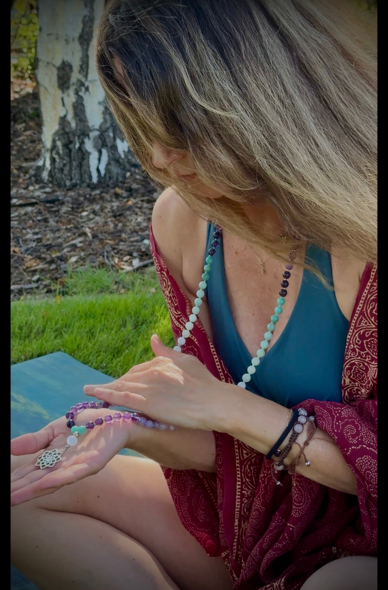 Sacred mala beads for letting go with amethyst, amazonite, lavender jade and white jade – perfect mindfulness gift and meditation beads. Mala for Pisces Zodiac Sign. Buddha charm, seed of life pendant and lotus charm. Worn by Marina Boccadifuoco. @mariblunotte