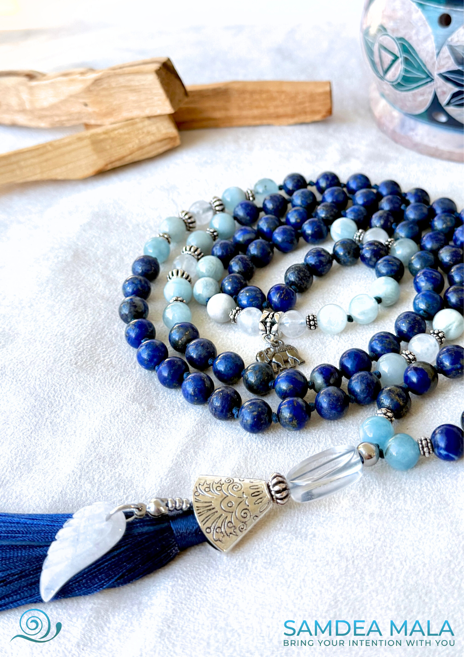 Aquamarine beads and lapis lazuli in the Blue Mala for meditation for Libra zodiac sign, promoting flow, acceptance, and gentle strength - close up