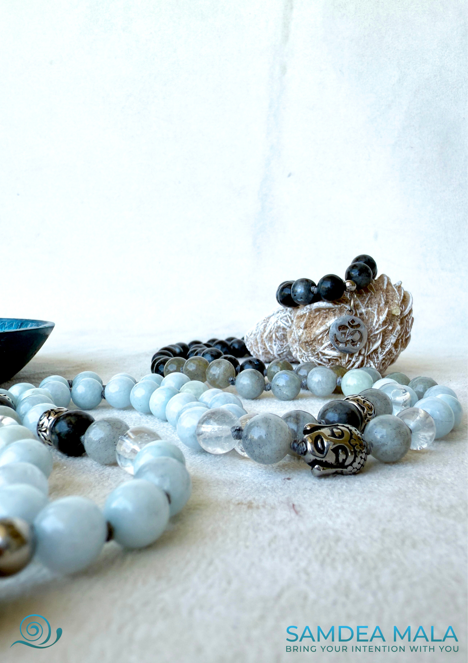 Buddha charm on a mala beads for meditation and minfulness, yoga gift, spiritual gift. close-up of a aquamarine mala for Aquarius zodiac sign