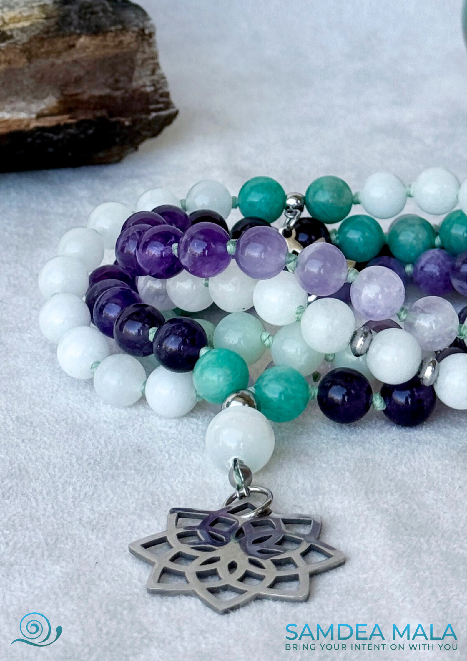 Close-up Samdea Mala for letting go and emotional healing – 108 bead necklace with amethyst, amazonite and jade. Mala for Pisces Zodiac Sign. Buddha charm, seed of life pendant and lotus charm