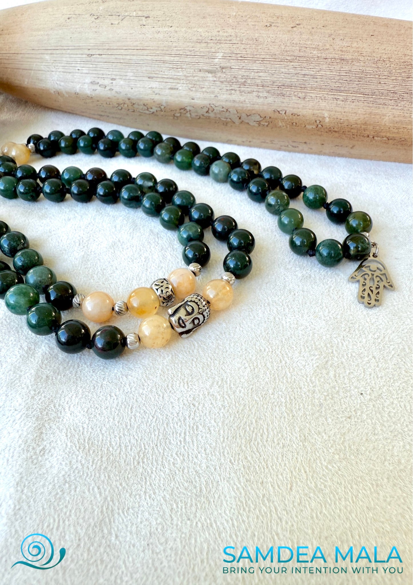 Close-up of Buddha and Hamsa hand charm in a moss agate and yellow jade beads – natural 8mm stones hand-knotted on durable cord