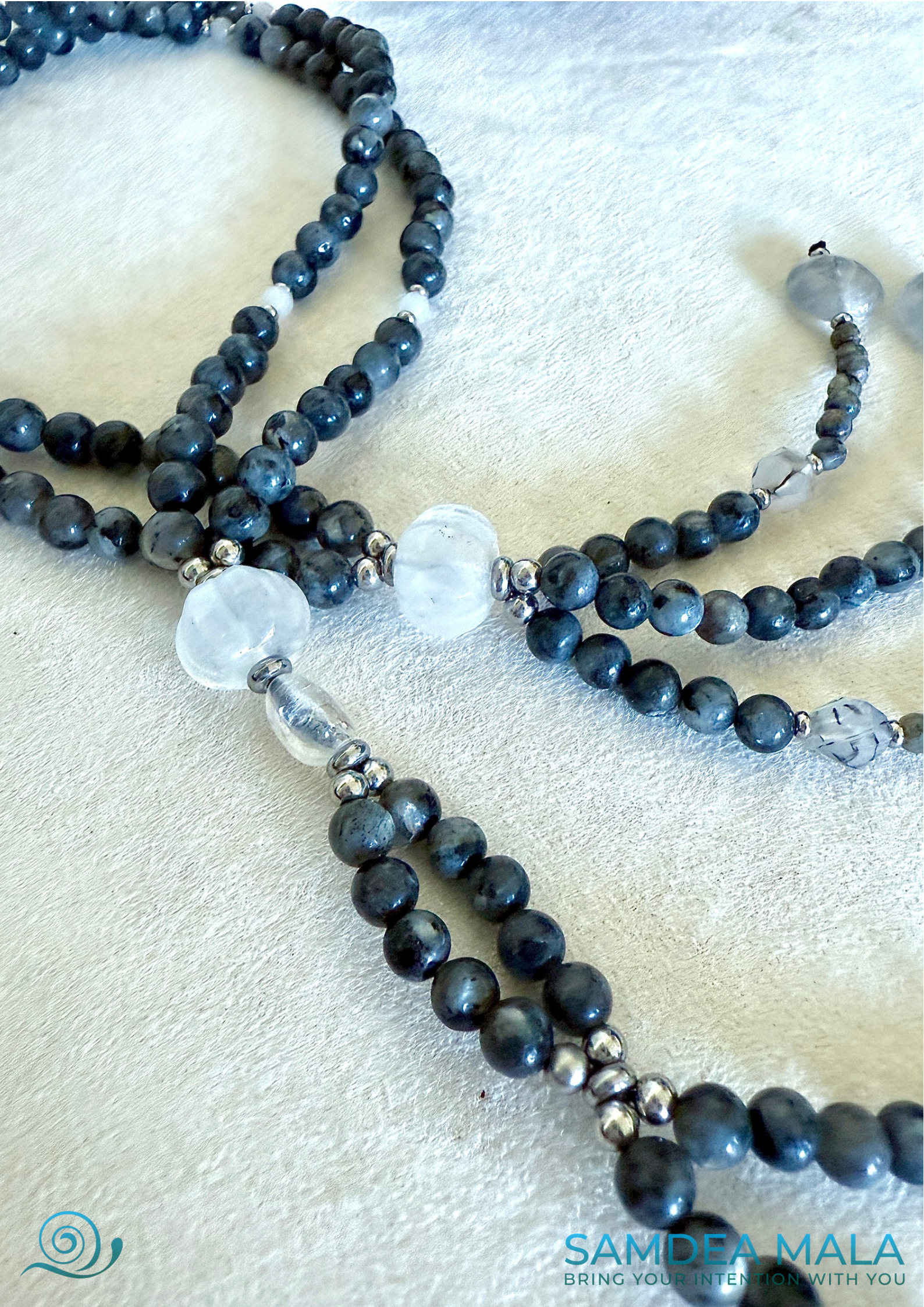 Close-up of grey larvikite beads with subtle flash on SGI Buddhist chanting juzu