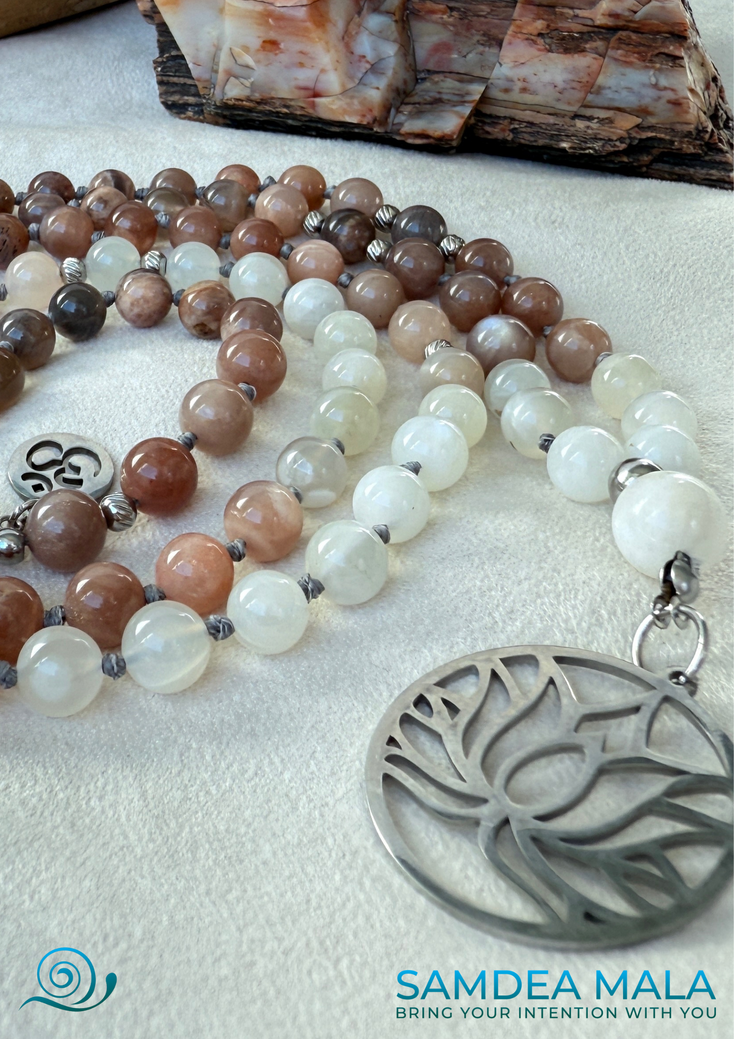 Close-up of lotus pendant on a moonstone mala beads