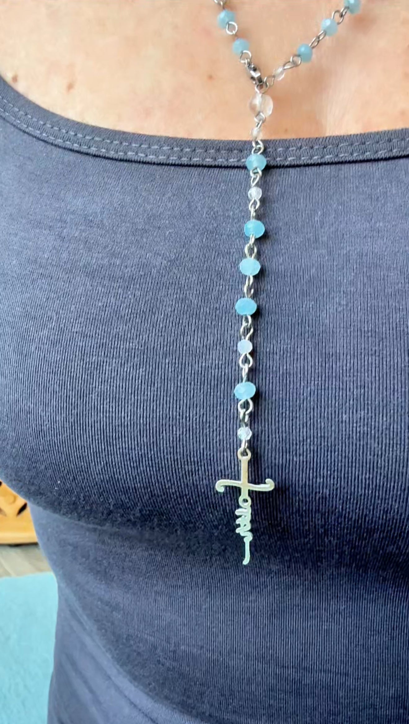 Close up of Catholic Cross Faith in God, Classic Roman Catholic rosary, handmade with stainless steel cross "faith". Prayer necklace, wearable rosary, rosary jewelry, rosary gift, spiritual jewelry, handmade rosary, crystal rosary, clear quartz, catholic beads, devotion gift, gemstone rosary.