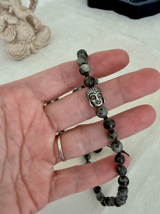 Detail Buddha Charm on Samdea Mala larvikite wrap bracelet with stainless steel Buddha charm and 6 mm natural stone beads