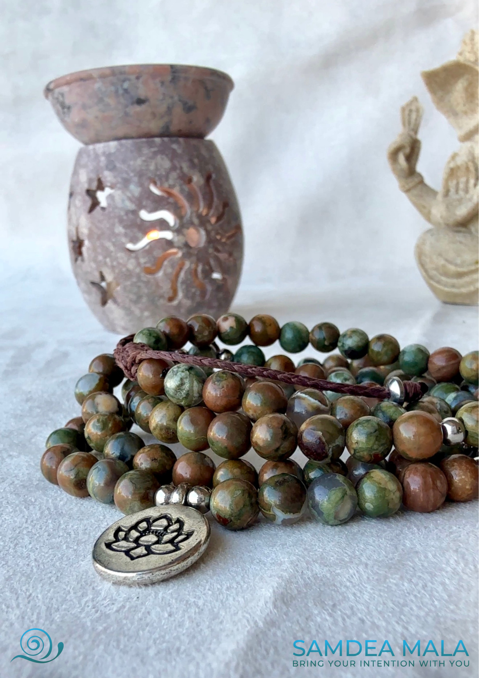 Featuring Forest Rhyolite jasper wrap mala bracelet with lotus charm, green and brown forest rhyolite for purity and transformation.