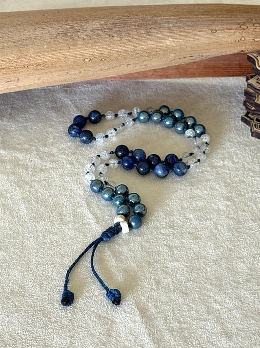 Full view of natural gemstone box breathing mala bracelet with groups of four beads to guide inhale, hold, exhale, and hold during breathing practice.