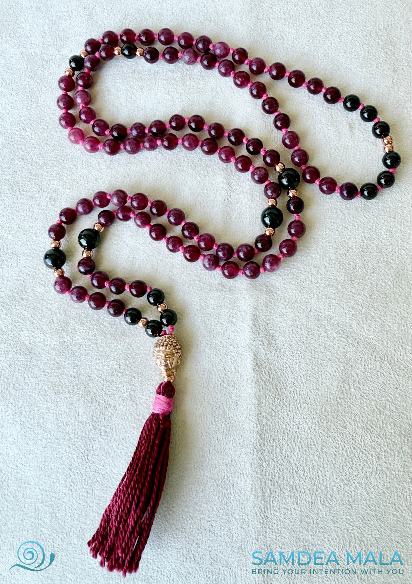 Full view of garnet mala necklace with silver Buddha charm, perfect for spiritual grounding and intention