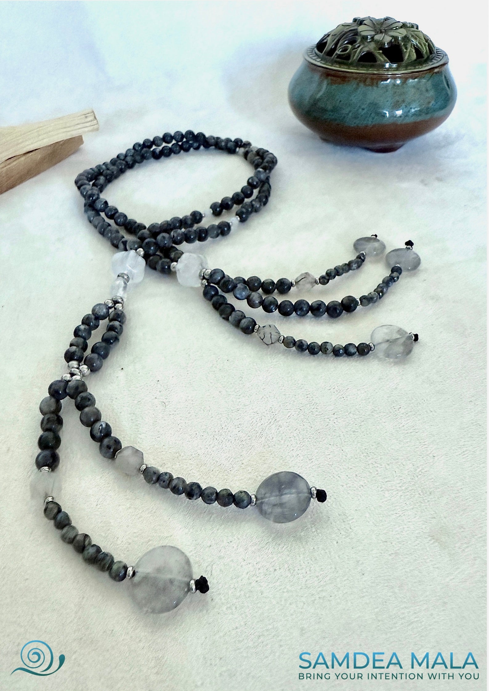 Labradorite beads showing blue-gray sheen on Nichiren prayer beads strand