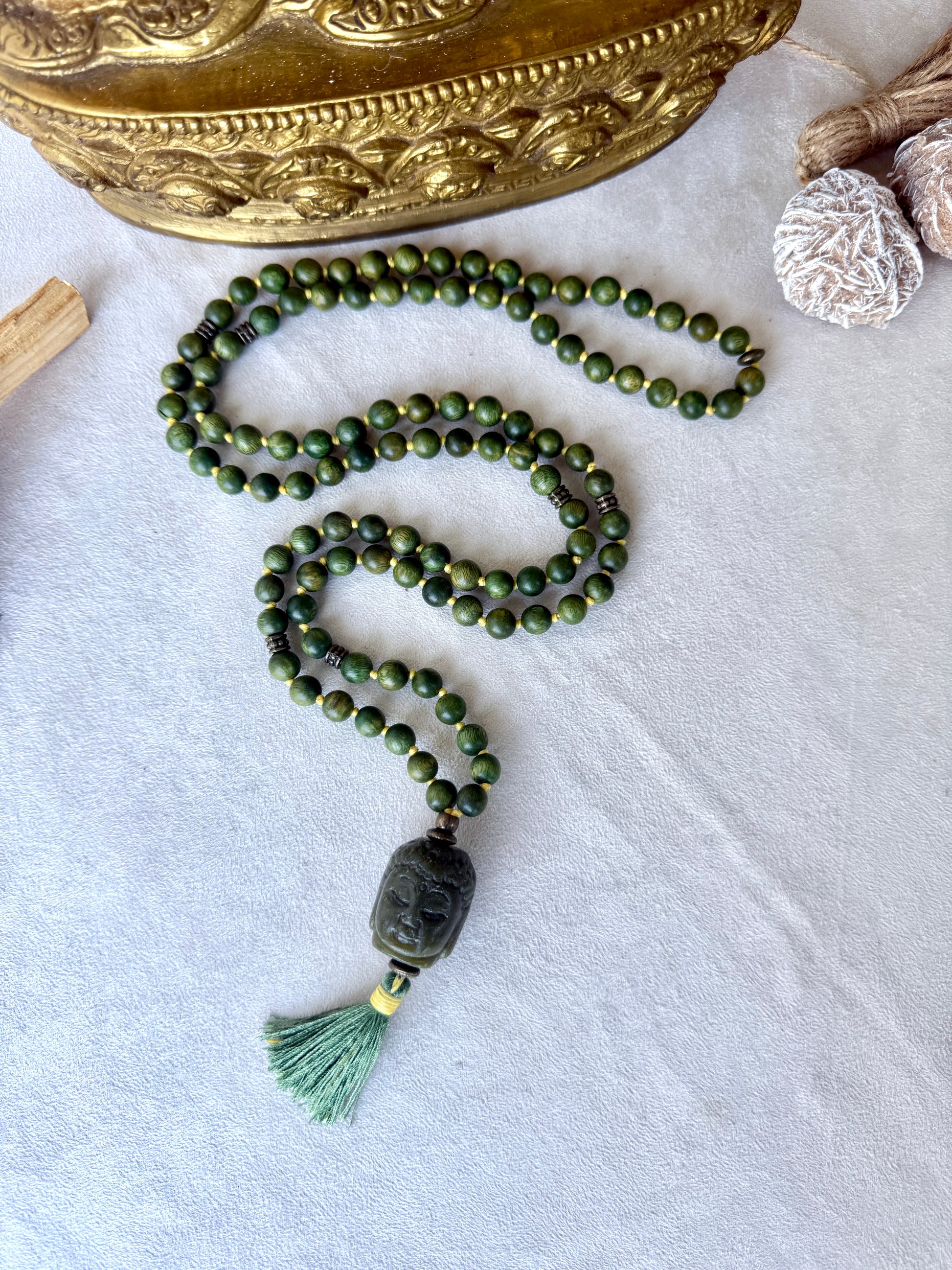 Hand-knotted sandalwood mala with carved jade Buddha pendant for meditation and mindfulness by samdea mala