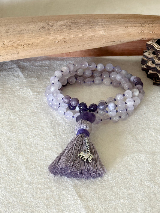 Handmade 108 bead mala in lavender jade, lepidolite and amethyst with white jade Bodhisattva pendant, amethyst meru bead and cotton tassel.