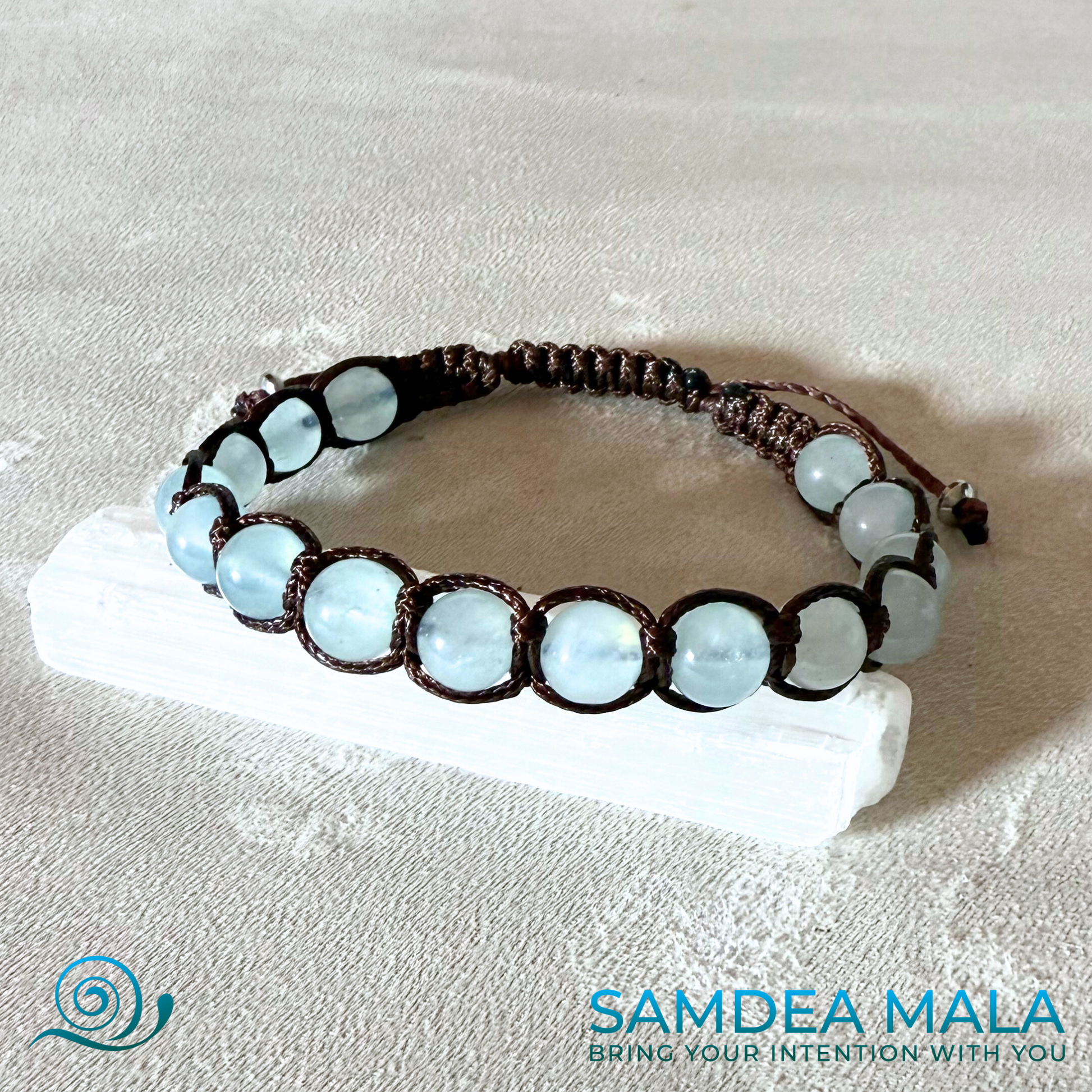 Samdea Mala Tibetan Tamasii-style aquamarine bracelet for emotional balance and peace, featuring clear blue gemstone beads.