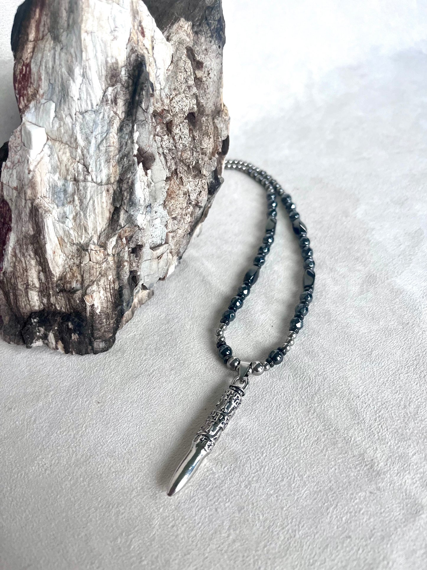 Close-up Men’s necklace with Om Mani Padme Hum mantra, steel and hematite for strenght