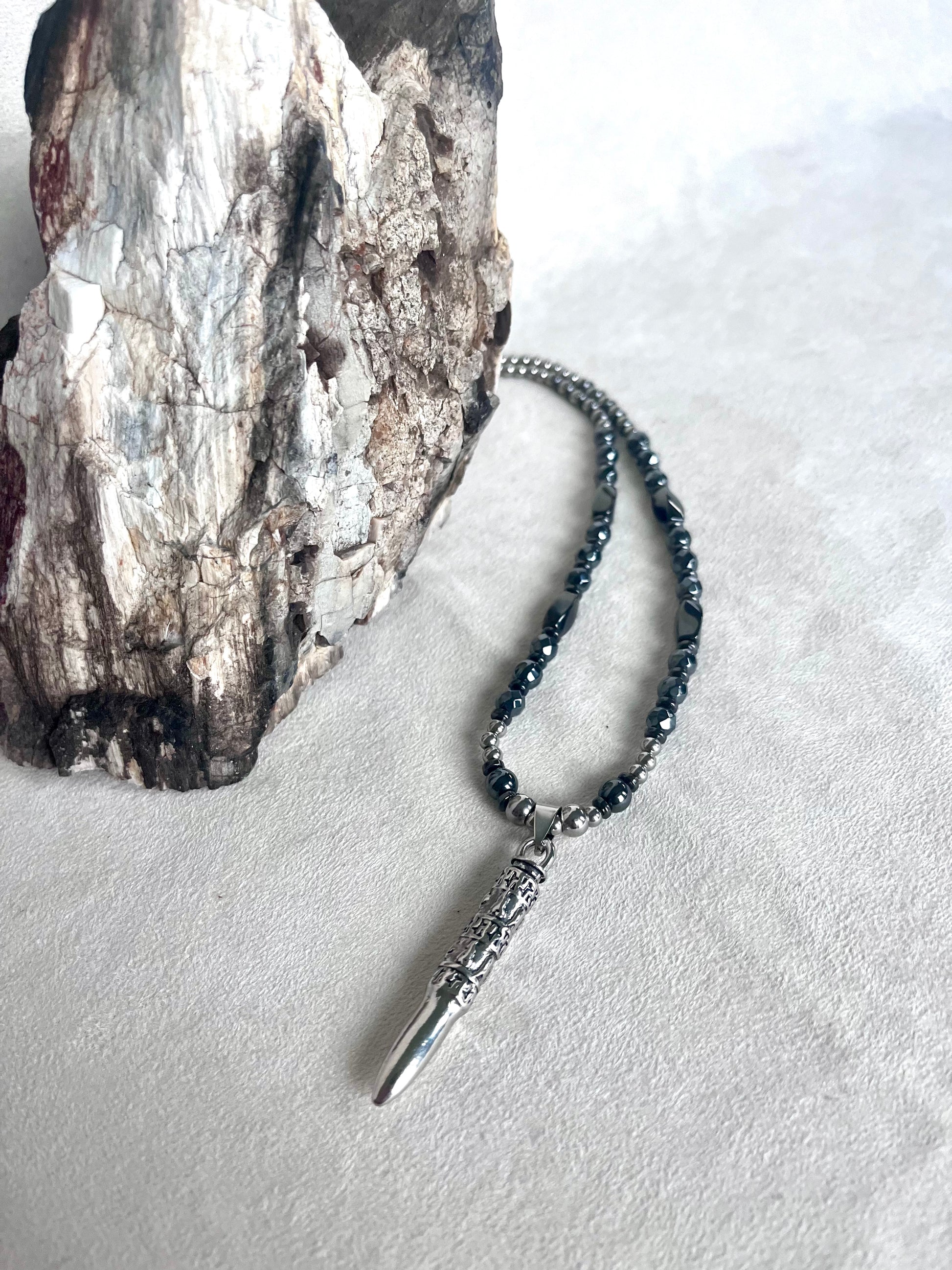 Close-up Men’s necklace with Om Mani Padme Hum mantra, steel and hematite for strenght