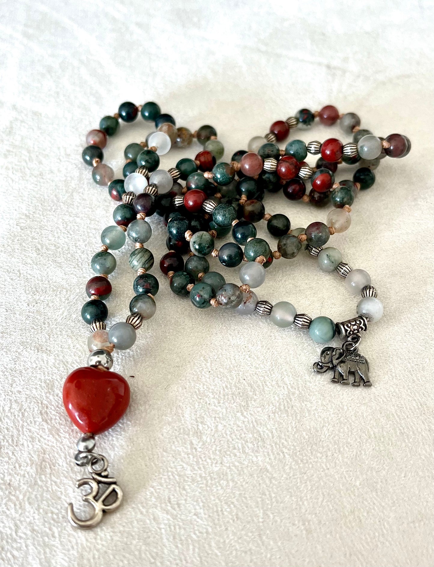 108 bead mala for inner strength, handmade Mala in Heliotrope with a Red Jasper Heart, om pendant and small elephant charm