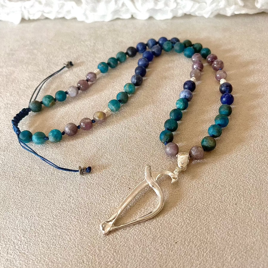 Odaka yoga symbol in a short mala beads for meditation