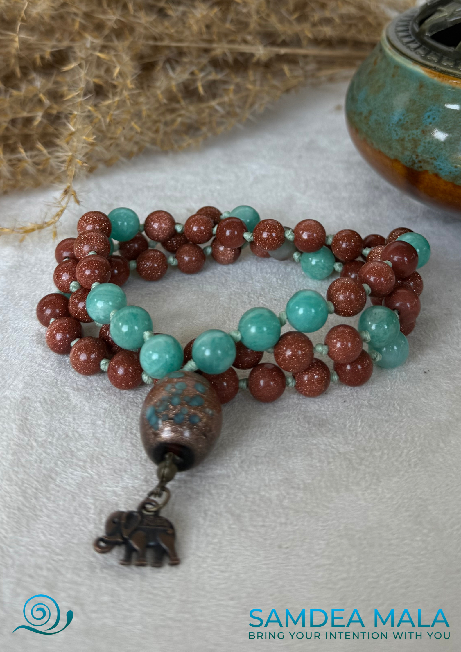 handmade mala with ceramic meru and natural gemstone beads. Japala for confidence and clarity with sunstone and amazonite.