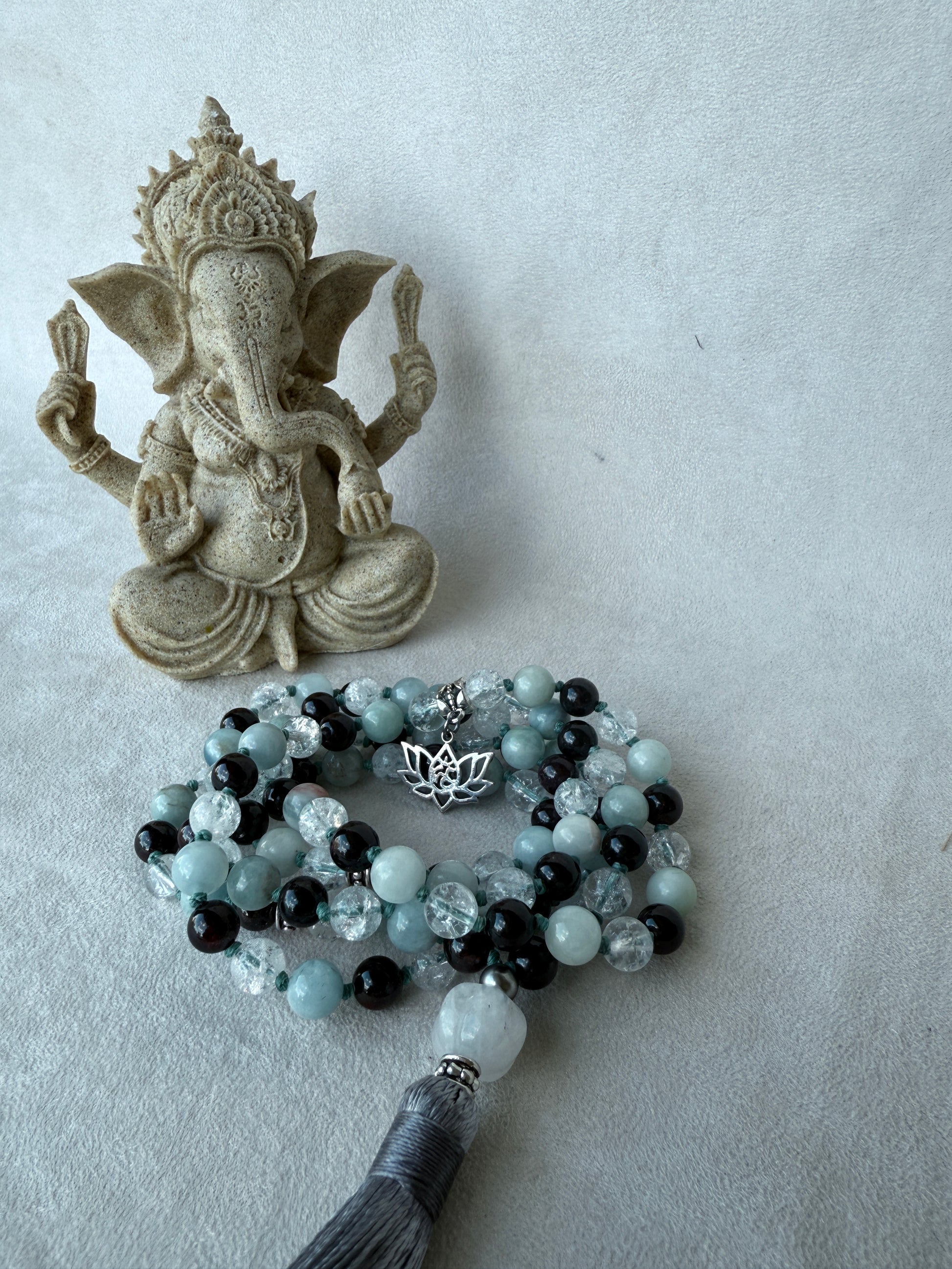 Lotus and Om charms on personalized mala necklace