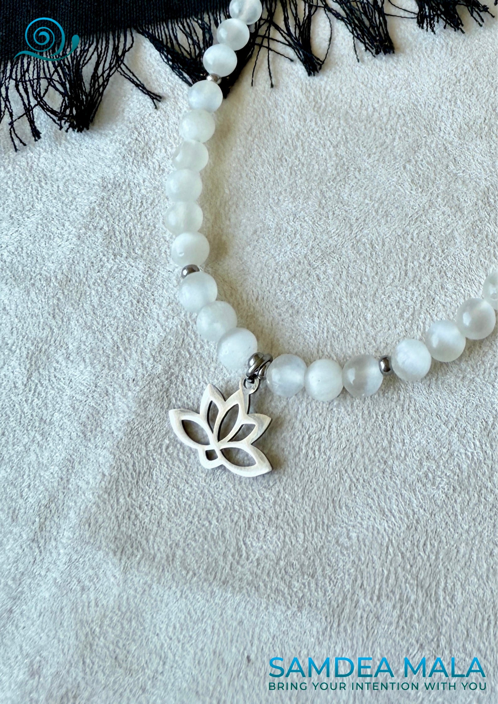 Lotus flower charm symbolizing rebirth and spiritual growth on selenite handmade necklace
