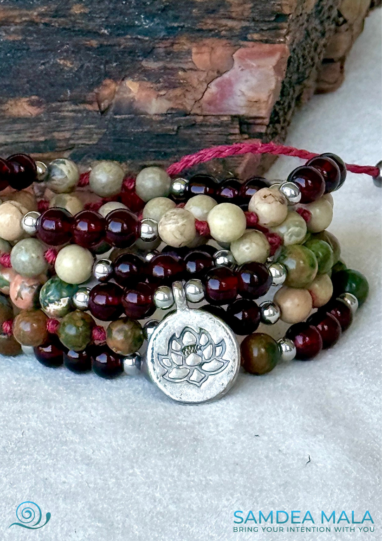Mala and Wrap Bracelet by Samdea Mala. Multi round bracelet spiritual mala beads in garnet and jasper with small lotus charm close-up