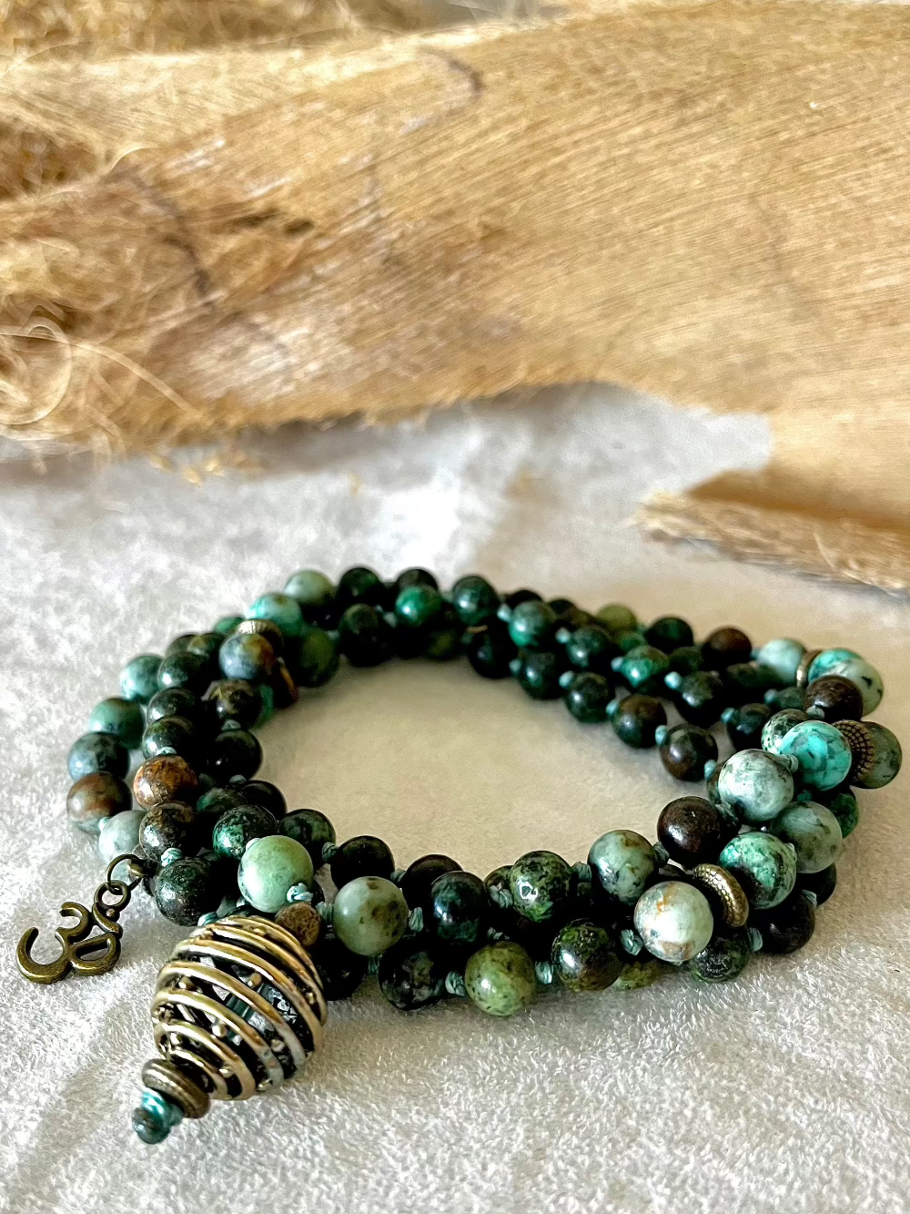 108 bead mala necklace in Turquoise Jasper with symbolic spiral sphere pendant for spiritual growth