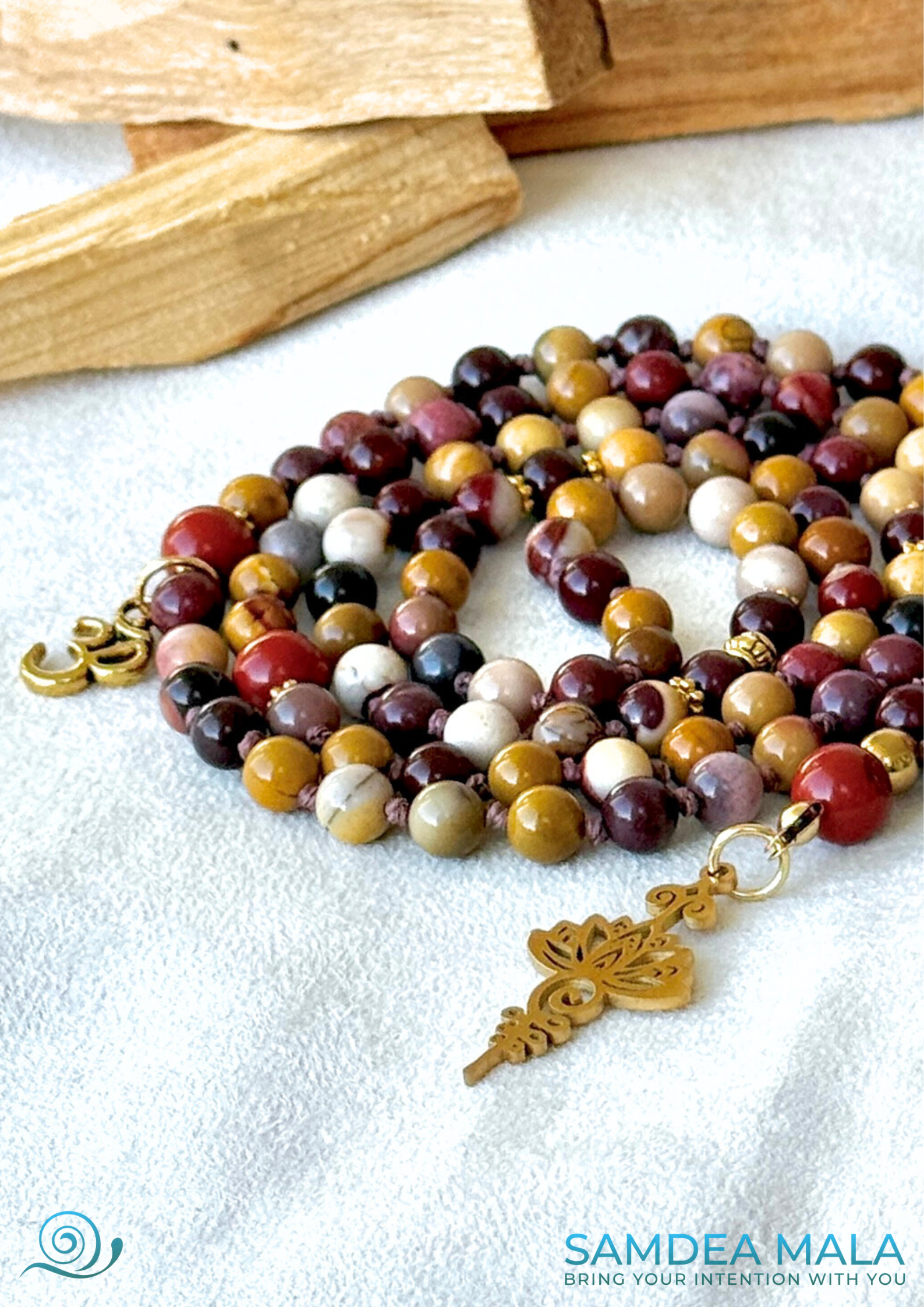 Mala in mookaite and red jasper with Unalome and lotus pendant and om charm detail - Samdea Mala