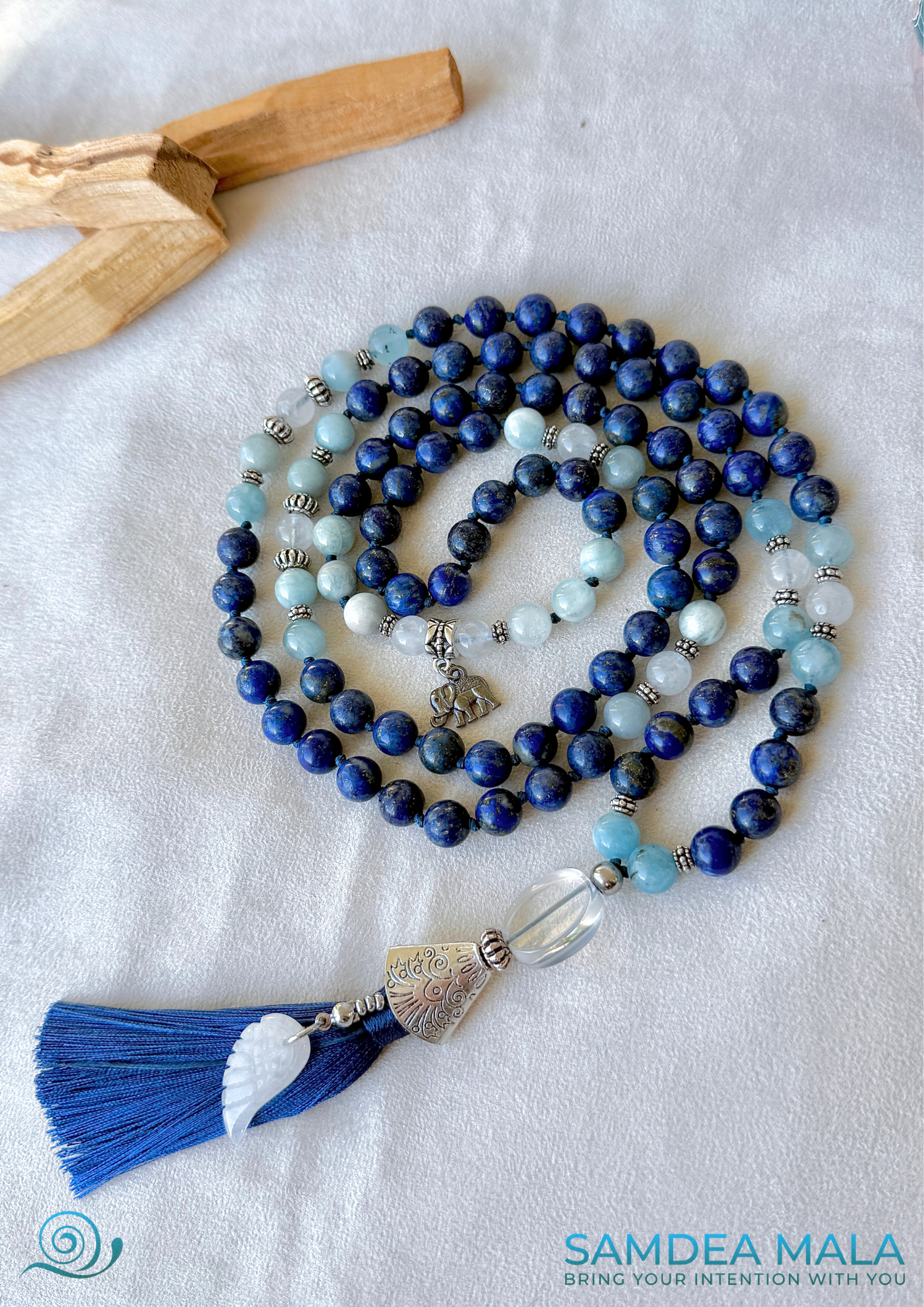 White jade Tibetan wing pendant on the Mala necklace for Libra zodiac sign, symbolizing peace, freedom, and spiritual growth