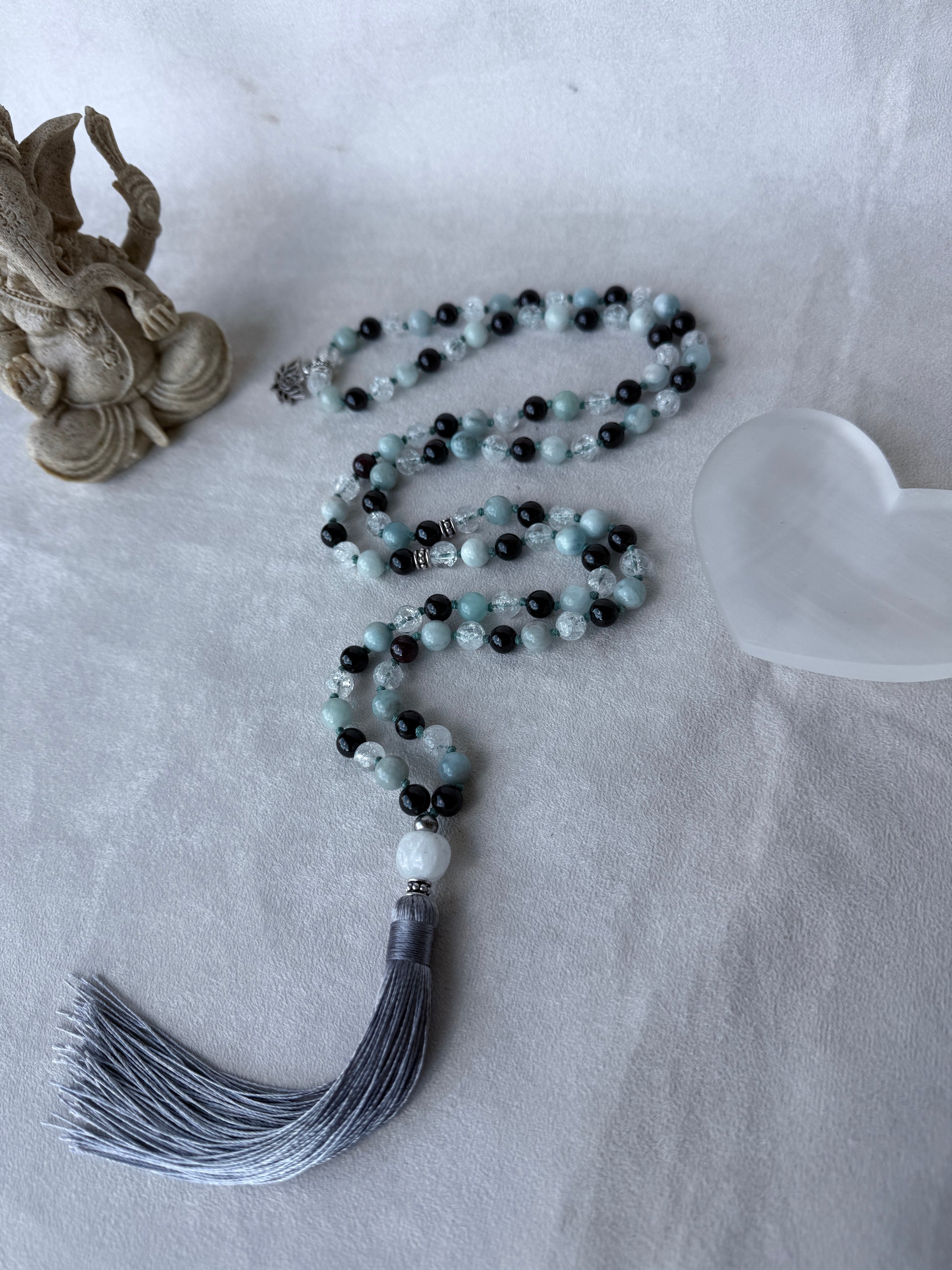 Full view of  Milky quartz meru guru bead on 108 prayer beads mala