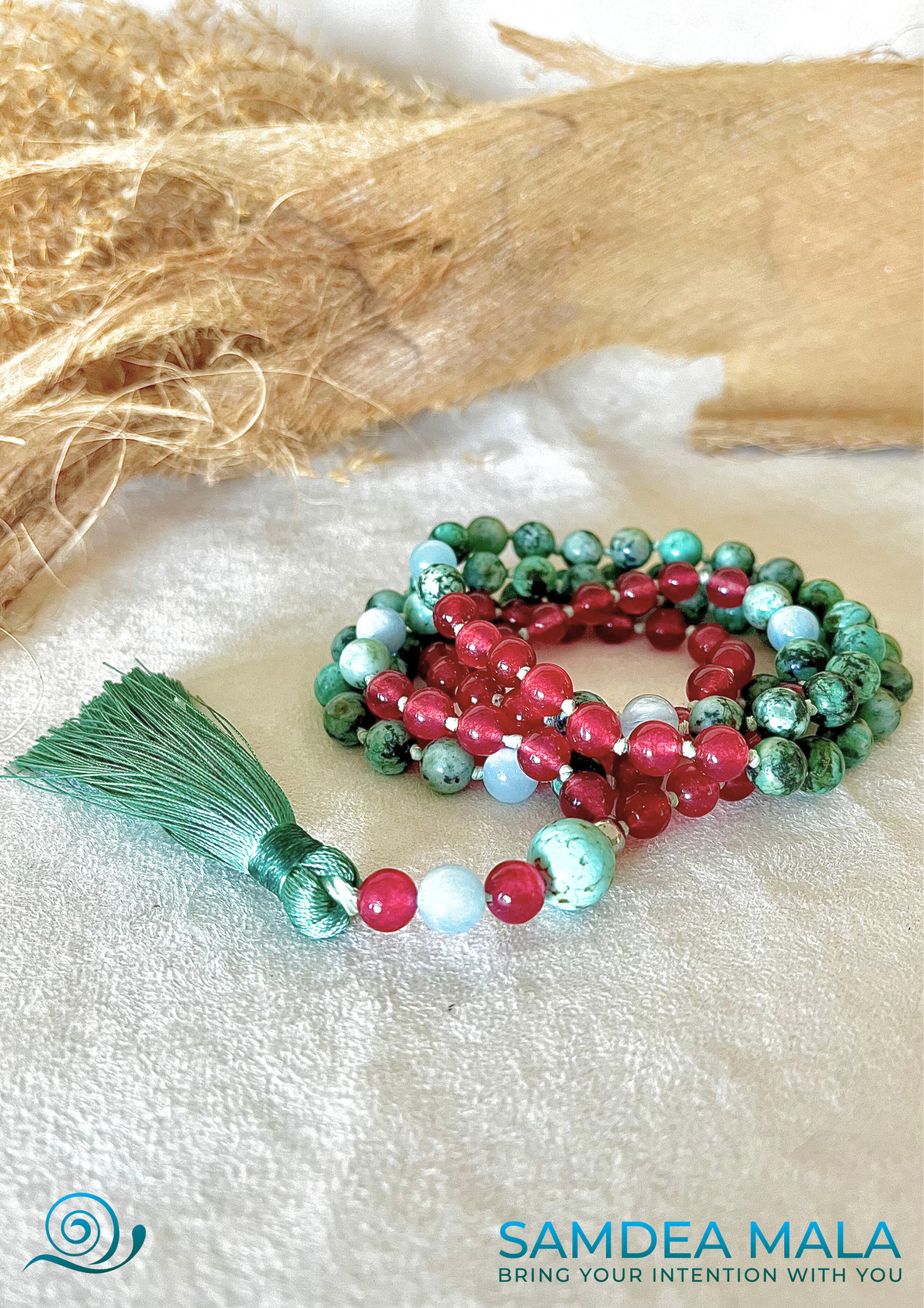 Multicolored, brilliant, and powerful mala — customized mala necklace with tassel, featuring teal, ruby, and turquoise stones.