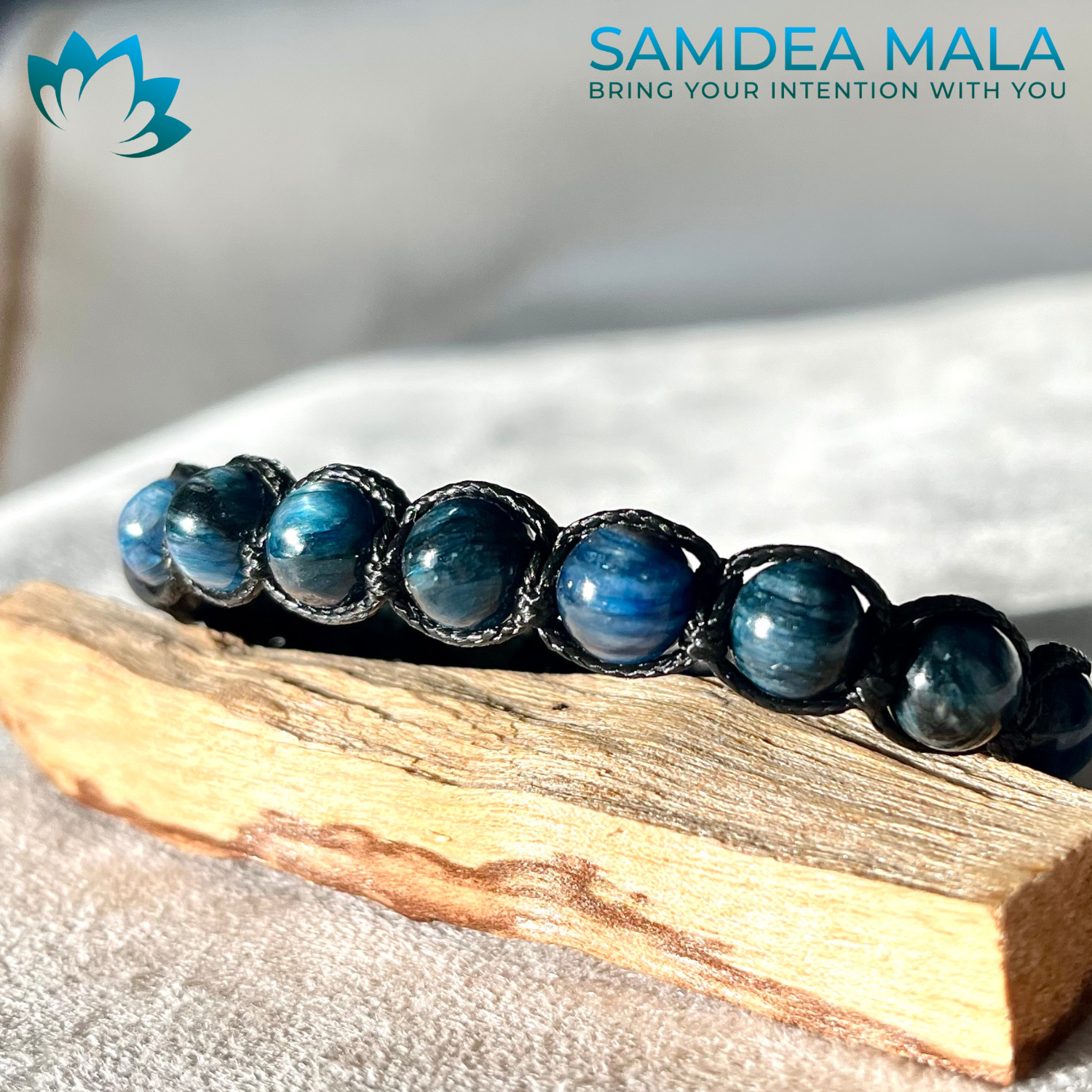 Samdea Mala Close-up Tibetan-style Kyanite bracelet on natural linen background Spiritual Kyanite Bracelet for Harmony and Self-Expression
