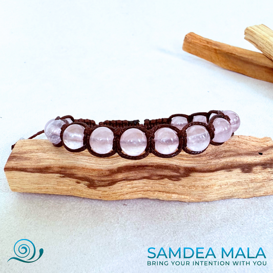 Samdea Mala Tibetan style bracelet in rose quartz, rose quartz beads for self-love. Rose quartz spiritual bracelet with Tibetan style knot. Gentle and calming crystal bracelet in soft pink. Meditation bracelet with natural rose quartz stones