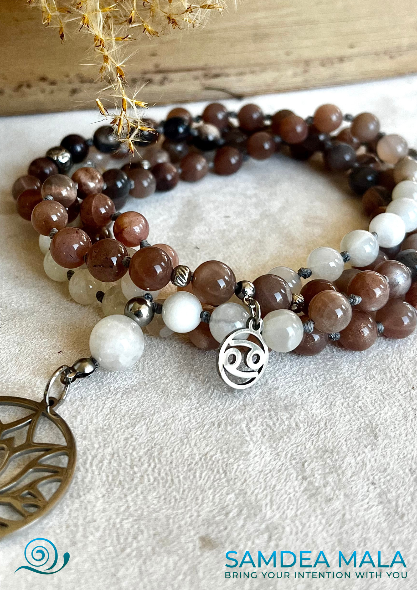 Feminine energy mala in moonstone with lotus pendant, handcrafted in California
Close-up of 108 moonstone beads in soft pink and gray hues, hand-knotted
Spiritual jewelry for intuition, lunar energy, and inner self-connection
Moonstone mala laid on altar with soft light and feminine ritual tools