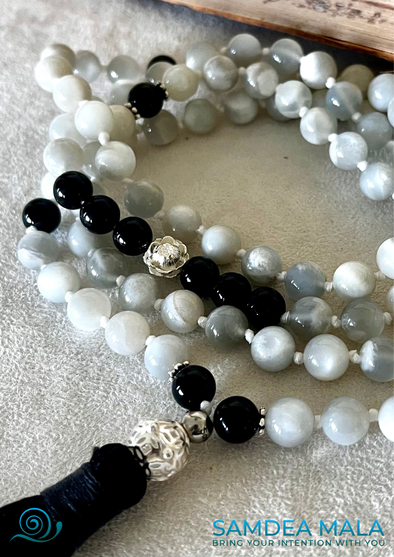 Close-up of Samdea Mala for meditation handmade in US– moonstone and black tourmaline for strength and protection