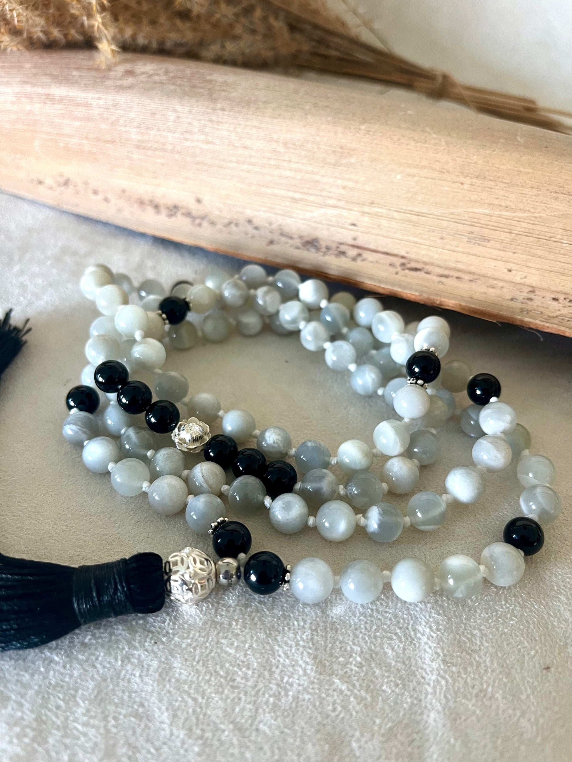 Detail of black tourmaline and silver – grounding and protective gemstone mala