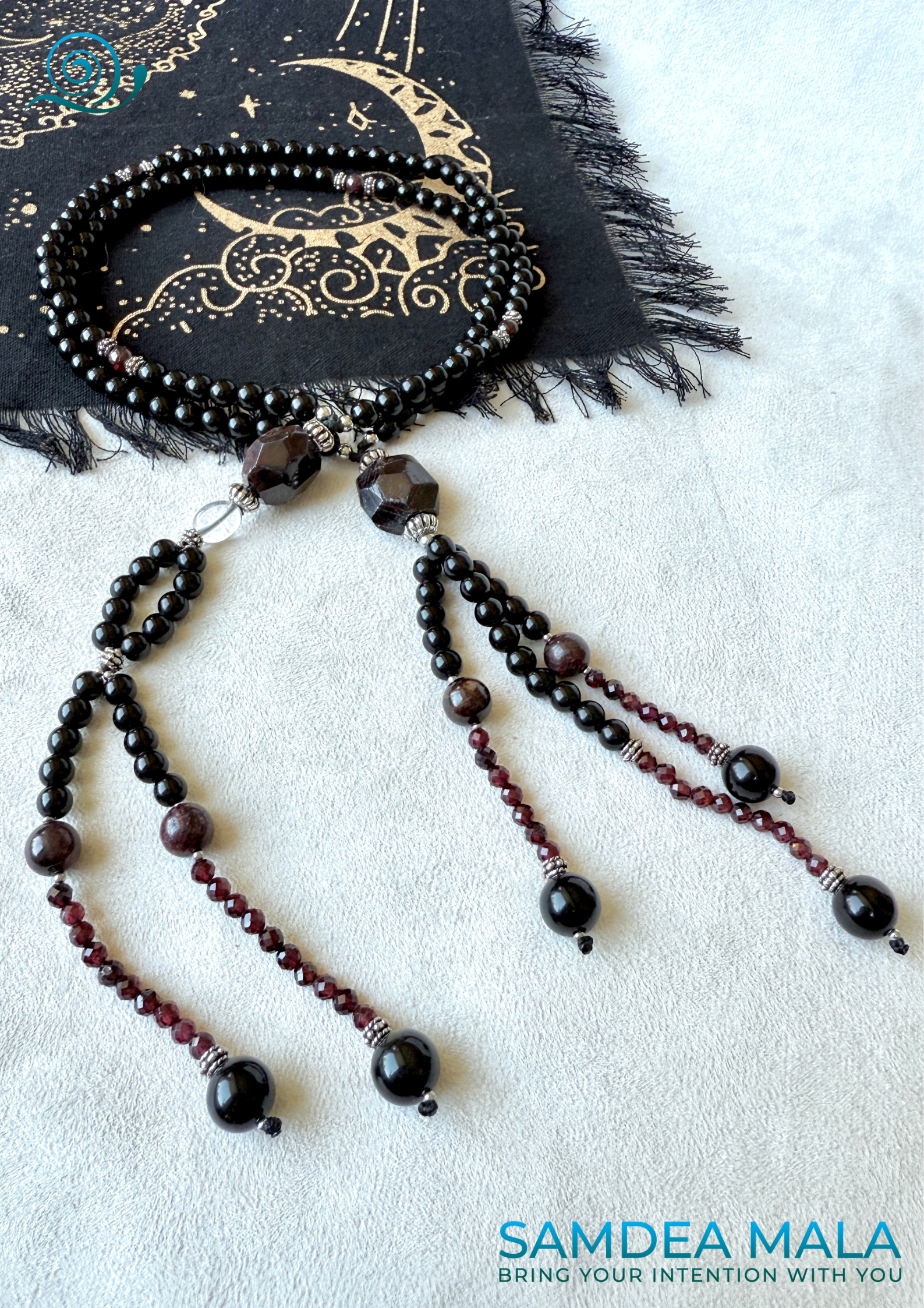 Obsidian and garnet juzu with clear quartz – a talisman of sacred protection, clarity, and devotion for your daily spiritual journey.