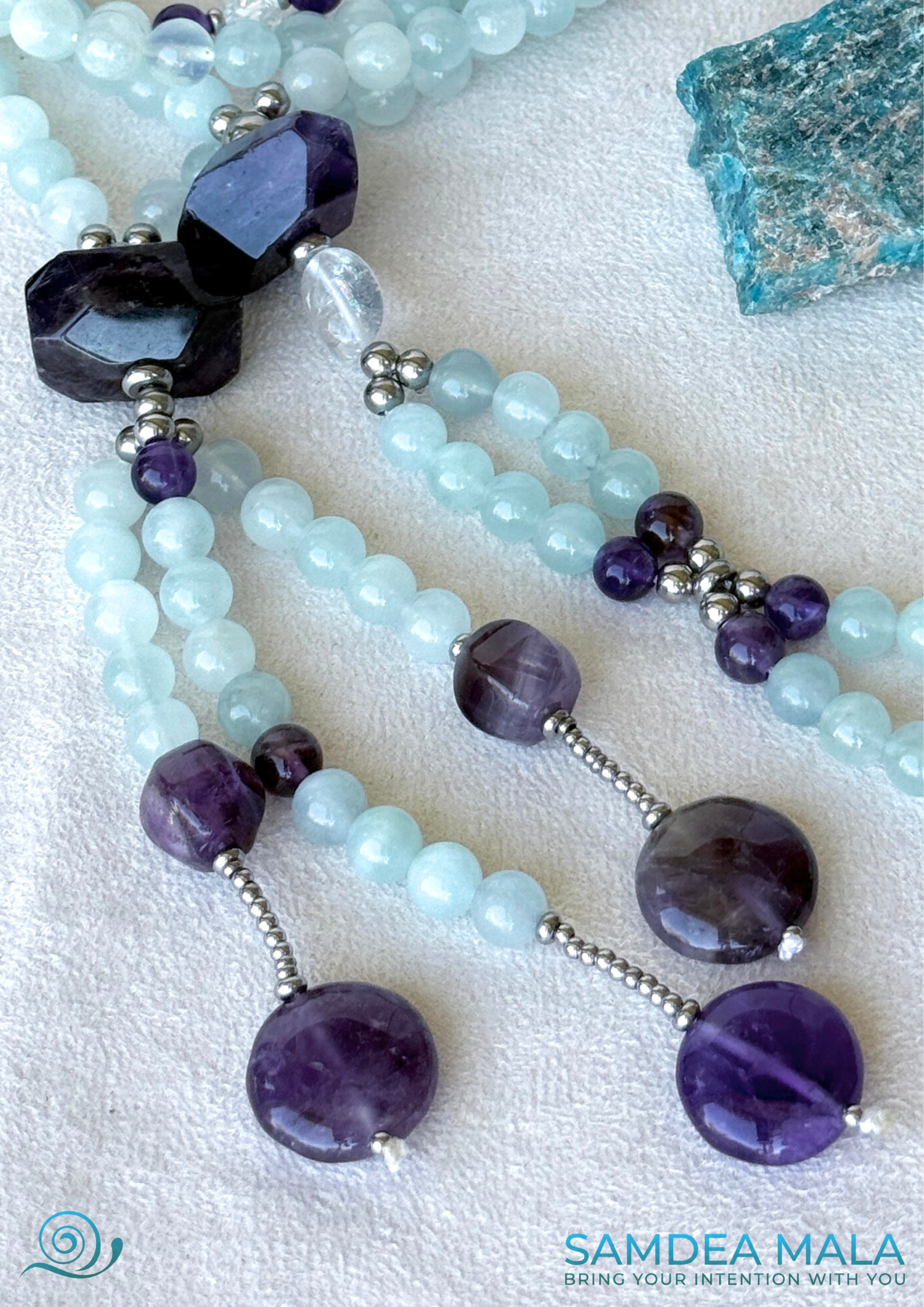 Detail of enlightment bead in clear quartz, handmade Nichiren Buddhist mala for Daimoku practice. SGI juzu mala by Samdea Mala