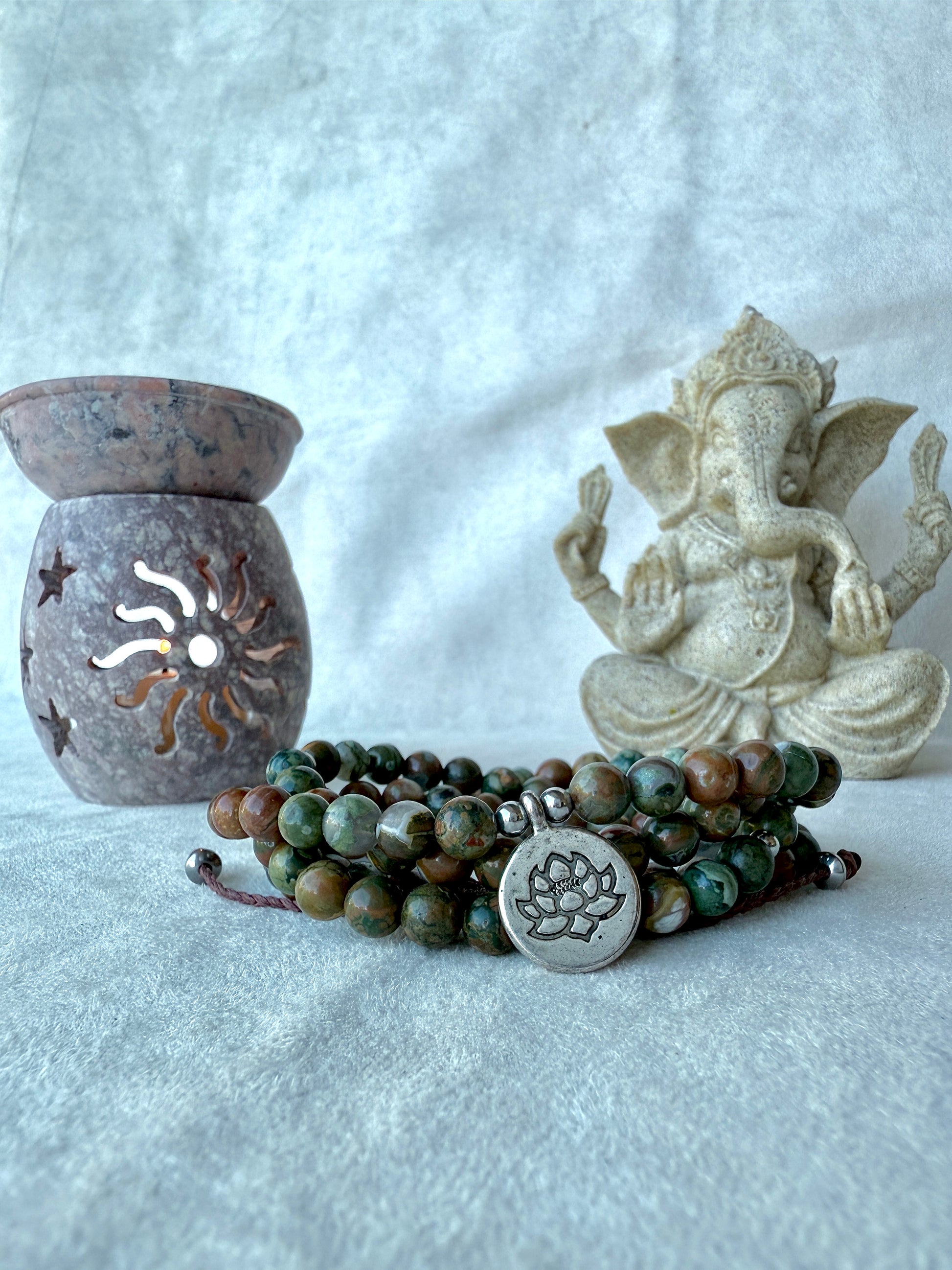 Samdea Mala Bracelet – Rhyolite Forest jasper wrap bracelet with lotus charm, green and brown forest rhyolite for purity and transformation. Jewelry for grounding and spiritual reflection.