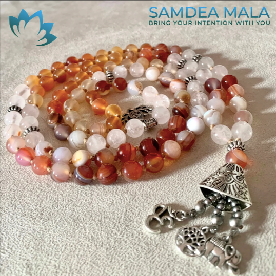 108 bead personalized mala. red agate, sardonic agate and small charms lotus, three of life and elephant. Red and white meditation gemstones