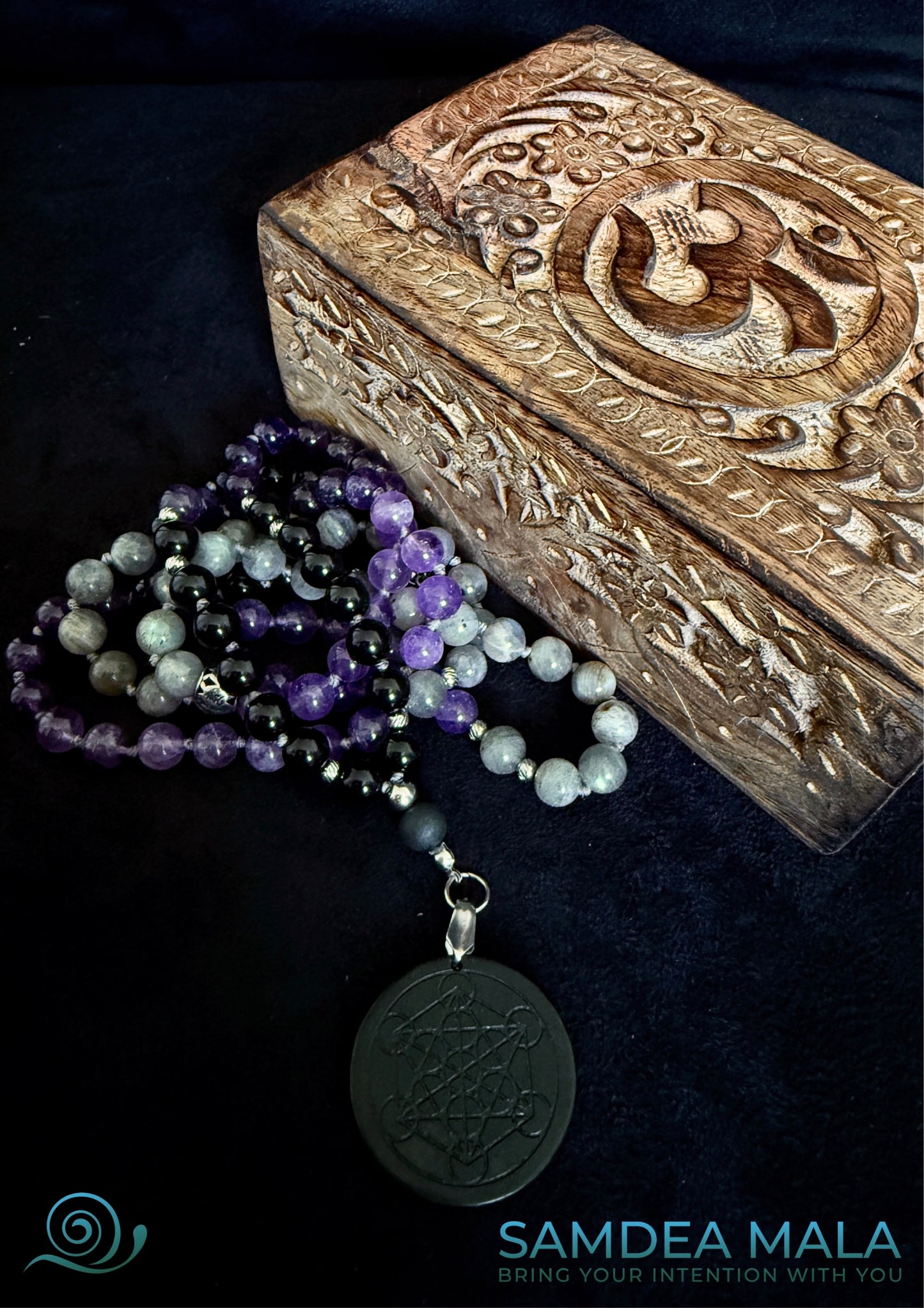 Shadow work mala and a woodden carve box with om. Obsidian, amethyst, labradorite, and shungite, hand knotted mala, handmade in US. 108 grounding meditation beads with dark feminine spiritual energy. Inner child and trauma healing mala