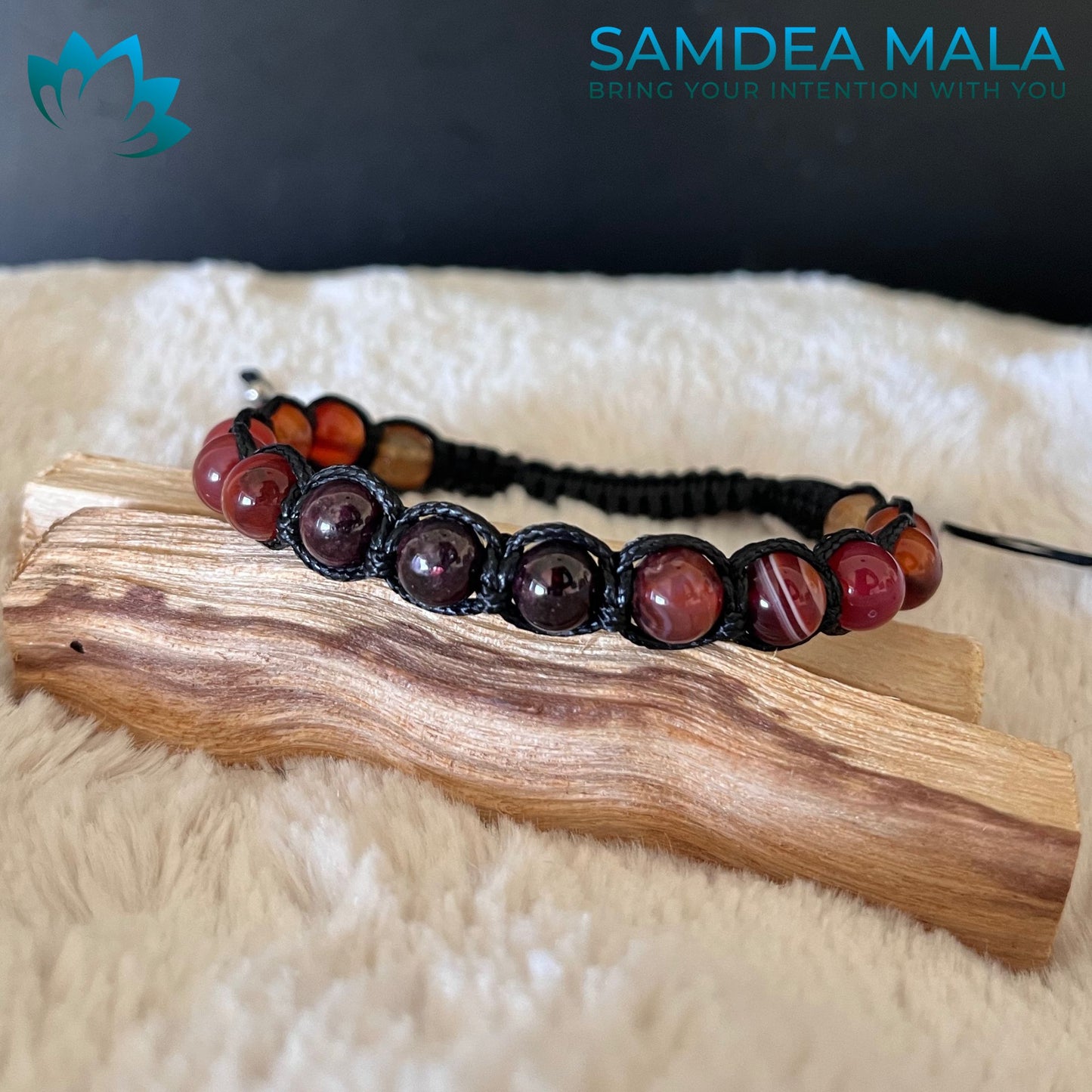 Intention bracelet featuring carnelian and dark red gemstone beads on a black cord. The bracelet has a sliding knot closure. Tibetan-style bracelet for meditation Shamballa style for energy, balance and inner power, red colour.