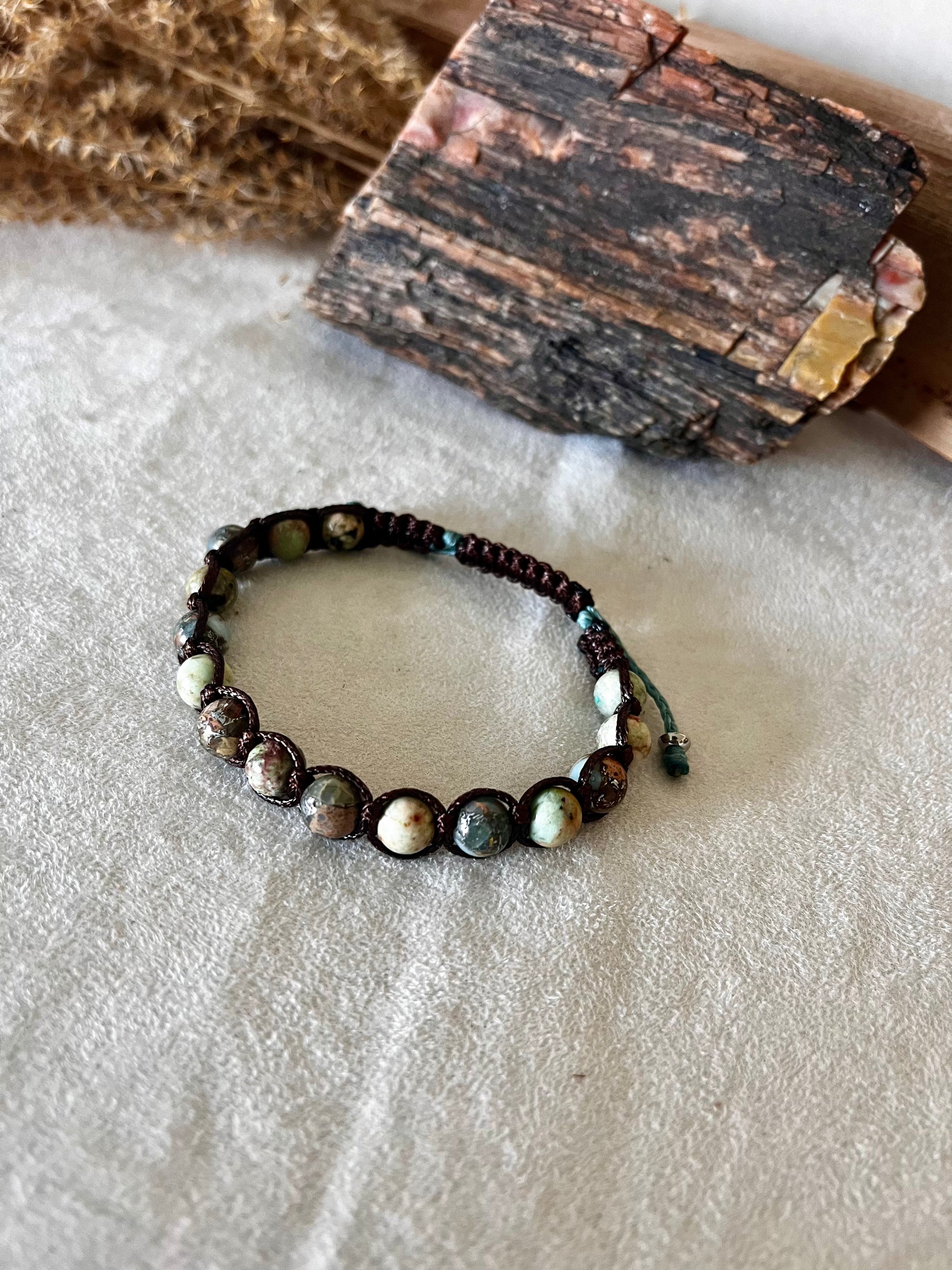 Tibetan bracelet in Aqua Jasper for calm and healing. A meditation mala bracelet and spiritual jewelry piece designed to support your personal intentions and inner peace.