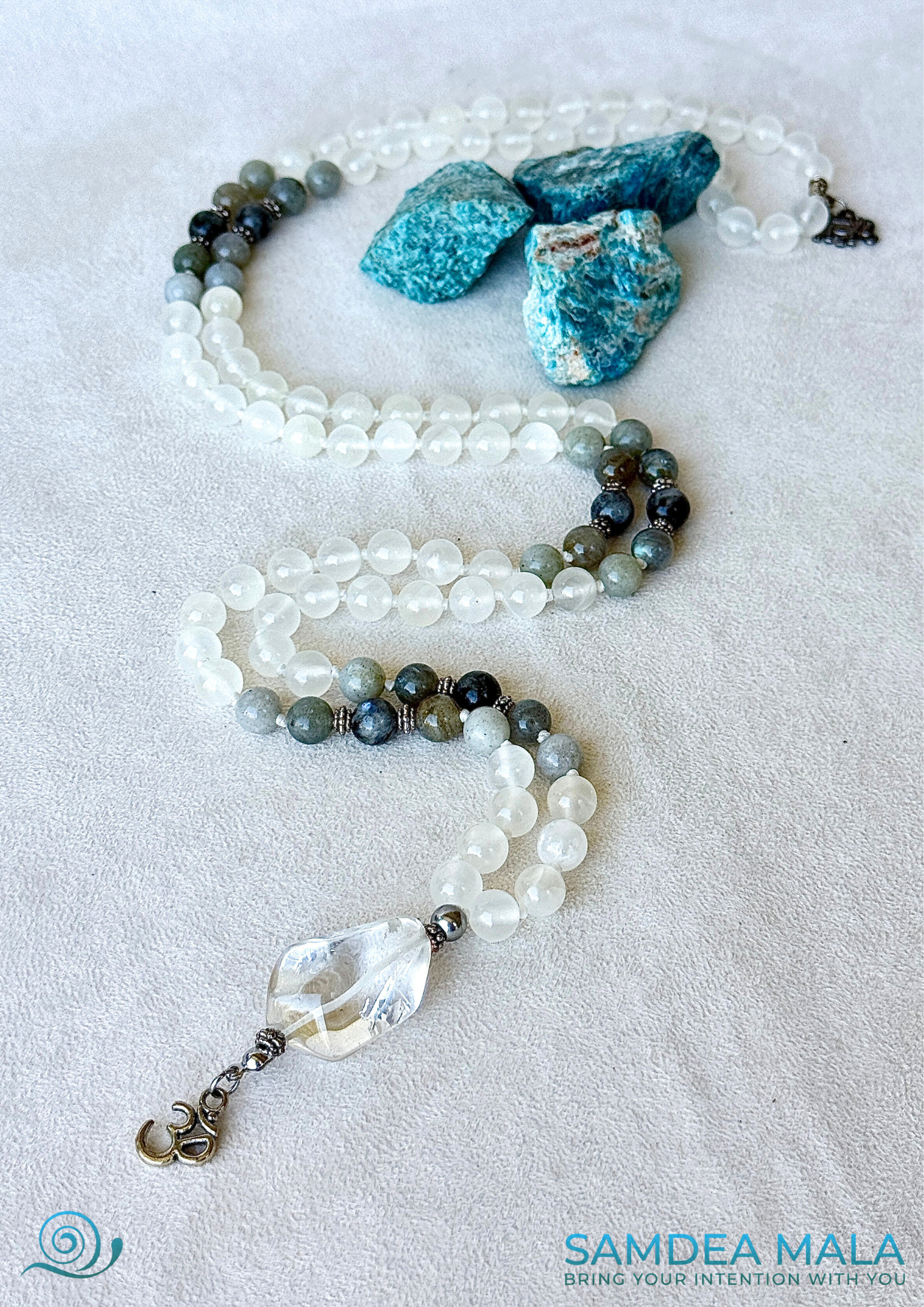 Close-up of White Mala for meditation in selenite amd labradorite, Mala necklace with om pendant, Custom mala beads for purification and success with om pendant. Natural gemstone mala