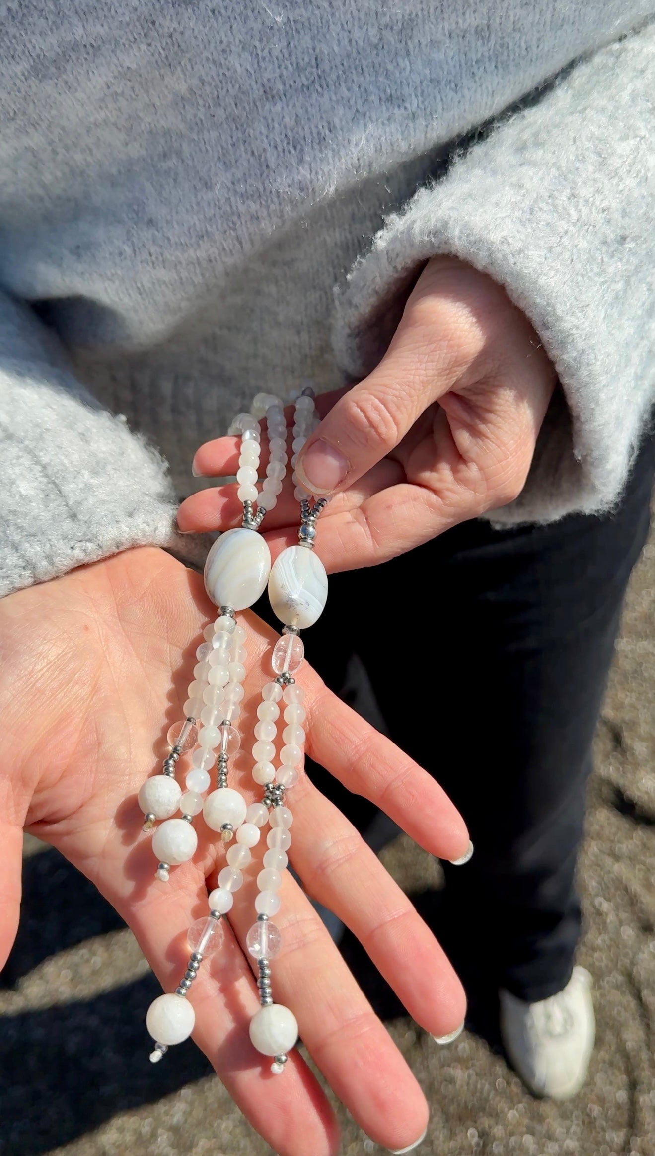 Hands holding White Juzu, handmade Moonstone Buddhist, traditional juzu Nichiren Buddhism