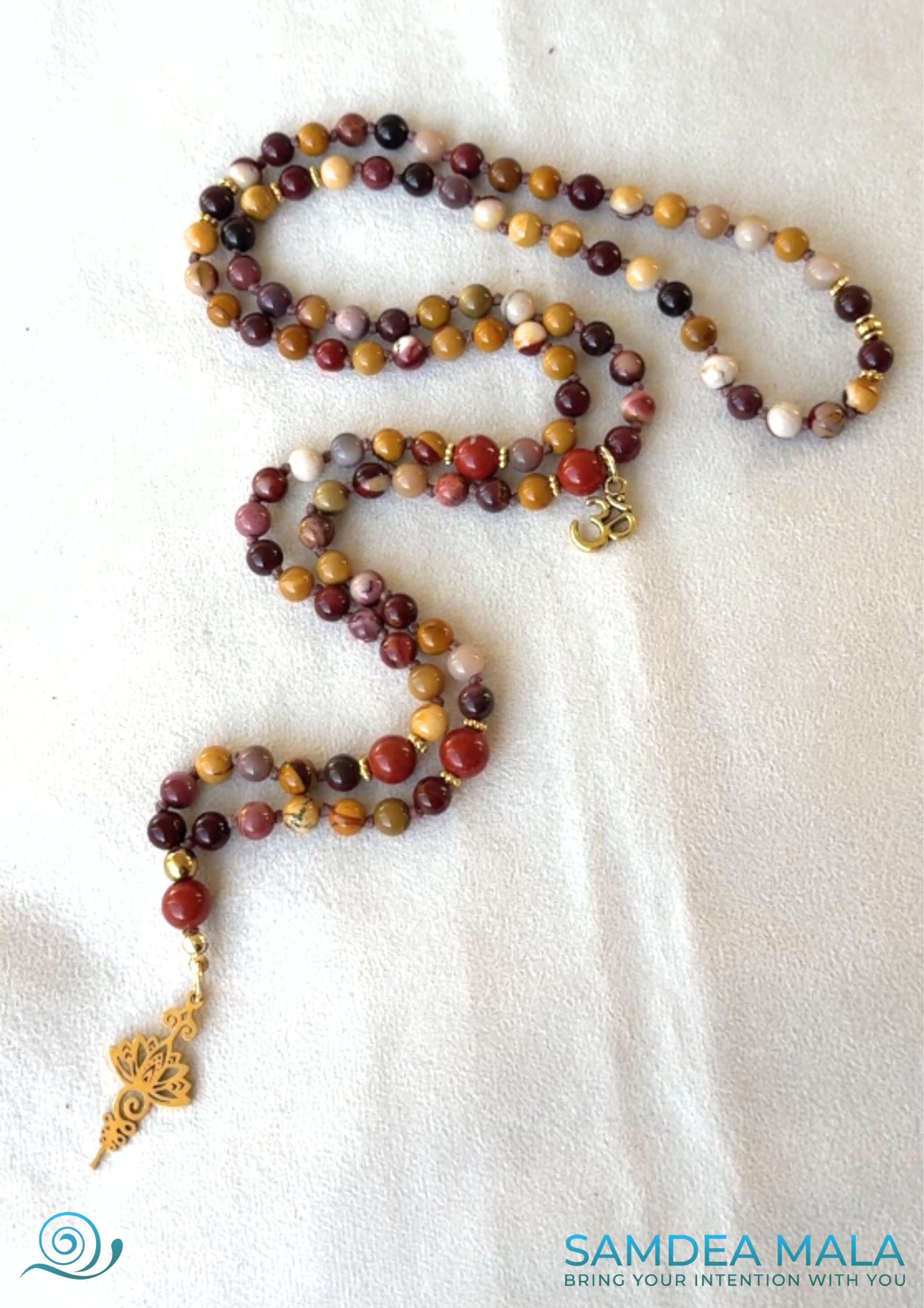 full view of mala for meditation for here and now, grounding mala neclace in in mookaite and red jasper mala with symbolic pendant for spiritual practice