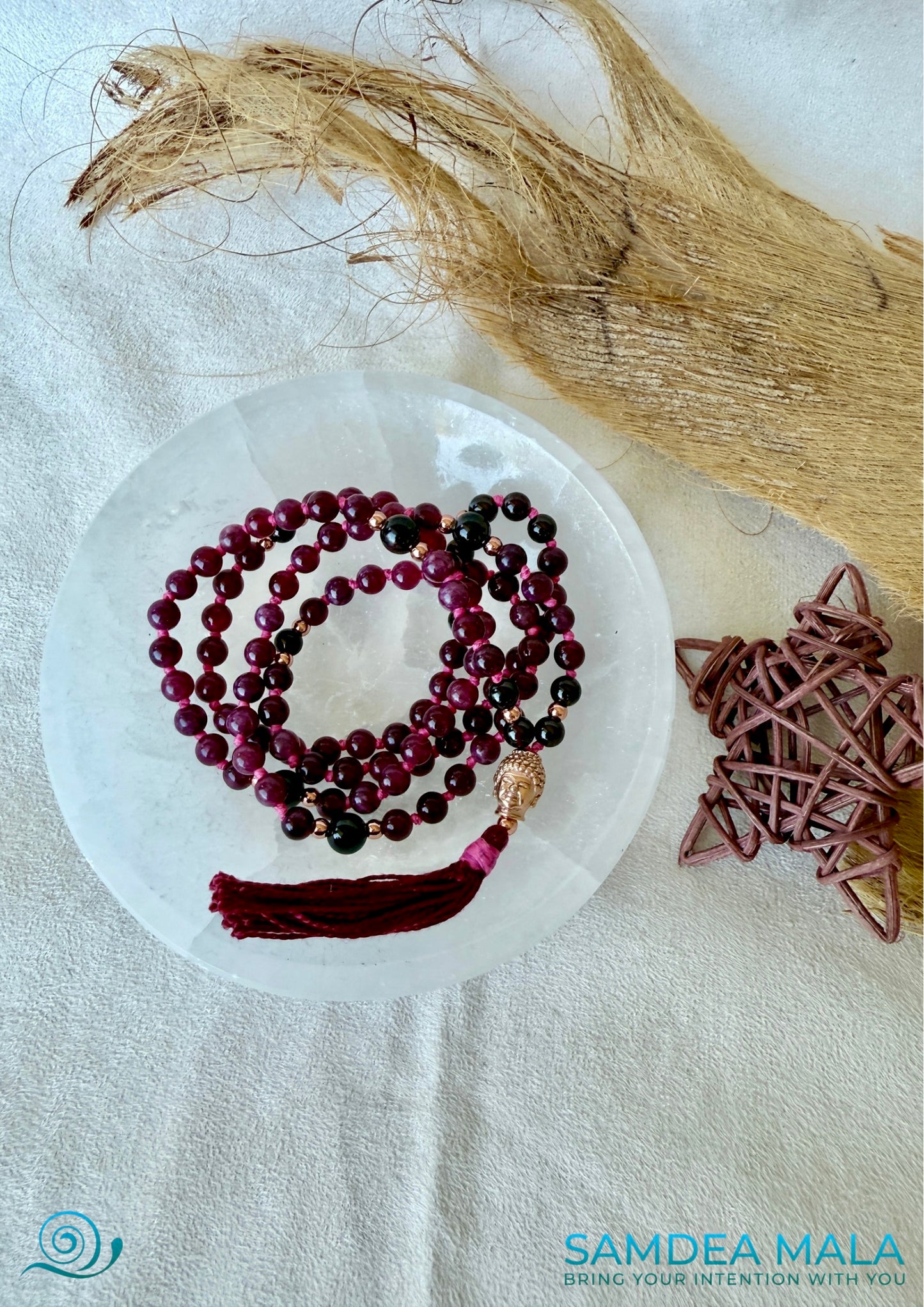 mala for self confidence and grounding in garnet, perfect for meditation and mindfulness on a selenite bowl