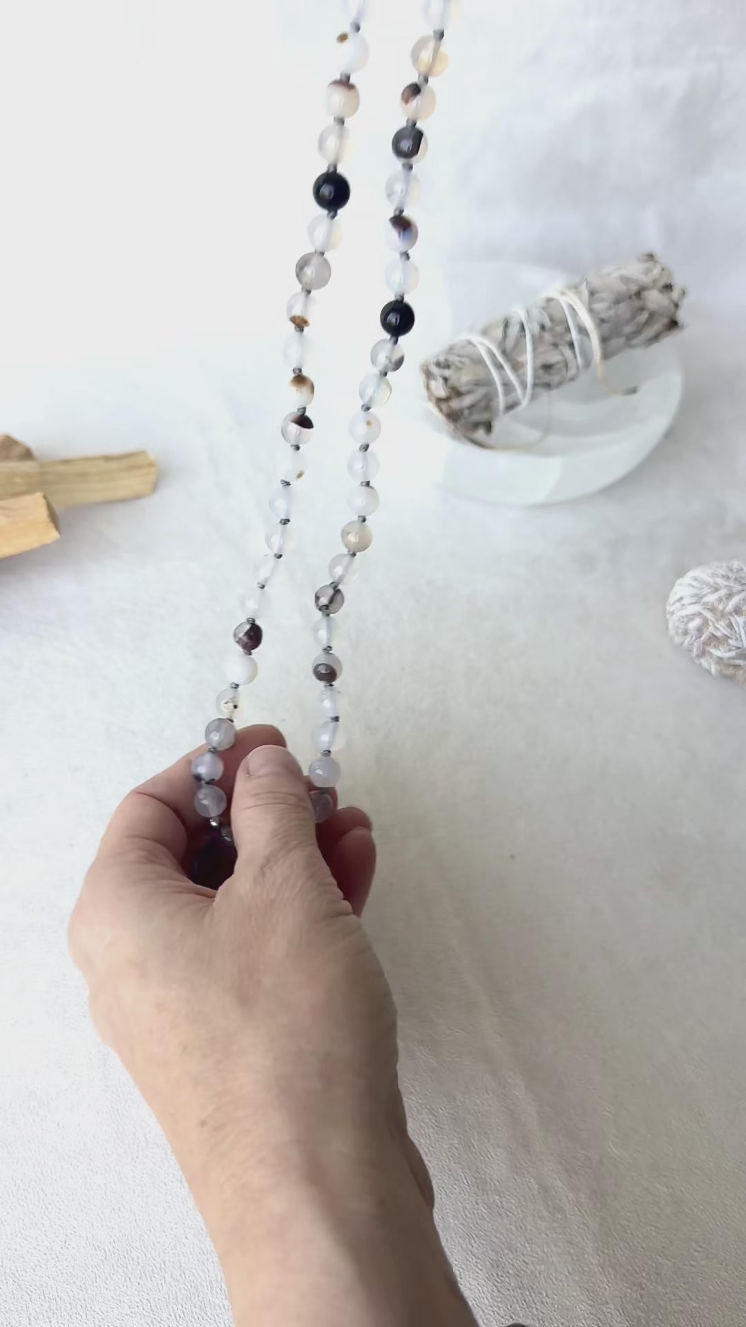 close-up of Handmade mala beads necklace in Dendritic Agate, Black Tourmaline, and Lava Stone for protection and balance. Gemini Zodiac Sign Mala by Samdea Mala