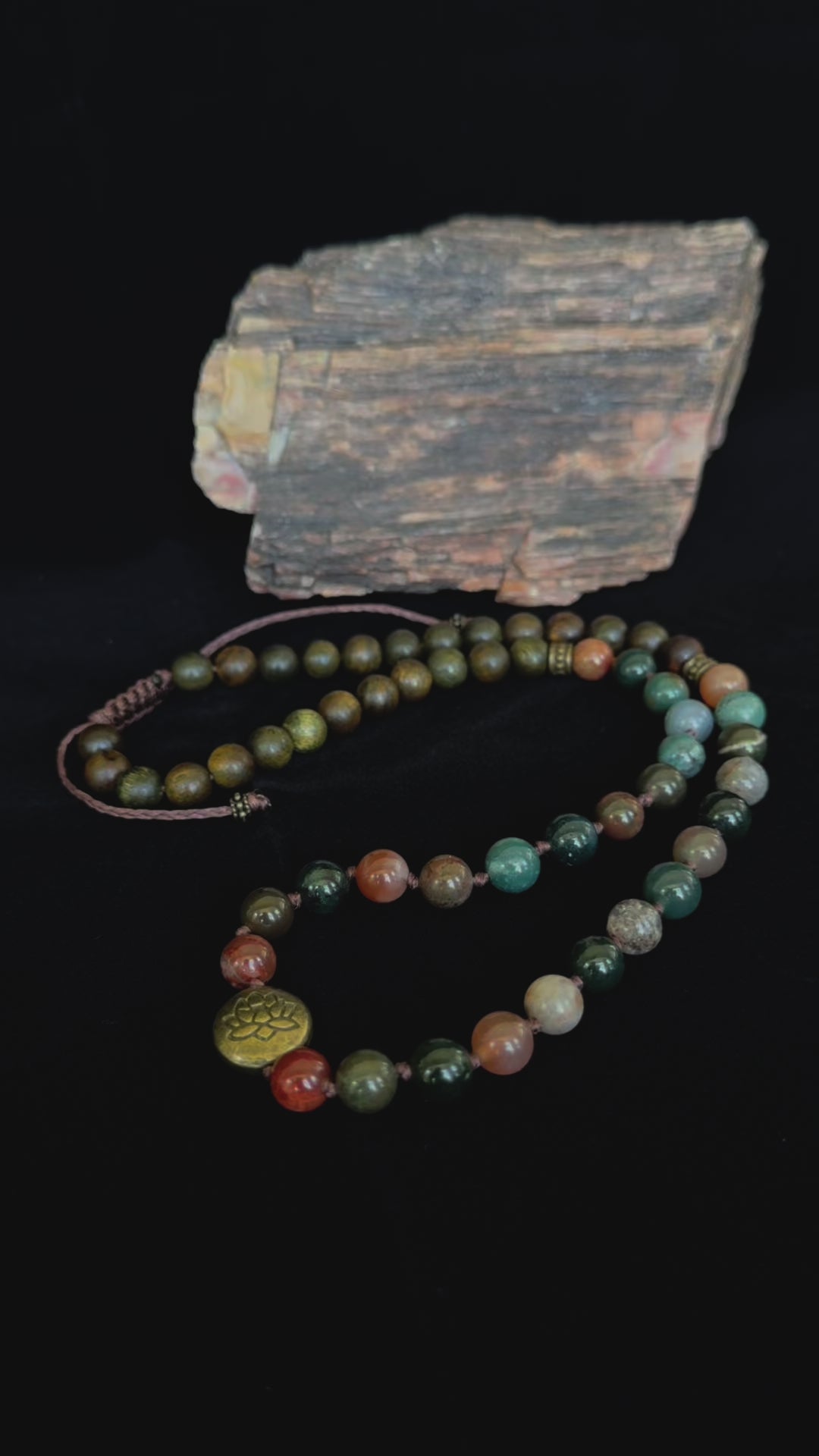 Video of wrap mala bracelet in earthy tones for spiritual practice