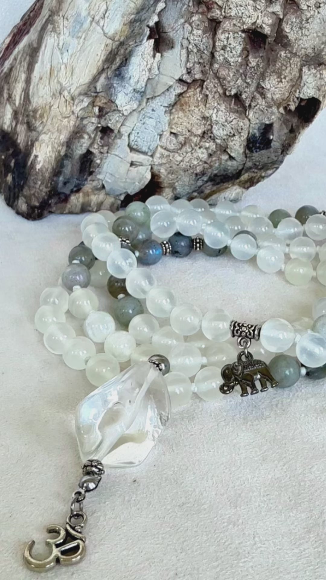 Video preview of Traditional Buddhist Mala beads for meditation in selenite, Mala necklace with om pendant, Custom mala beads for clarity, 108 prayer beads, Spiritual gift for protection, Labradorite for success. Samdea Mala