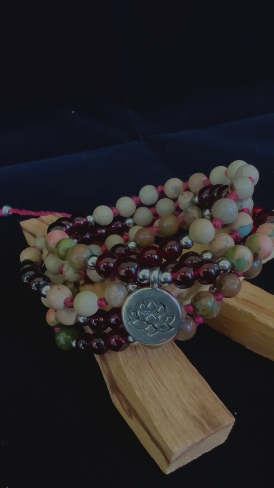 Video Mala and Wrap Bracelet by Samdea Mala. Multi round bracelet spiritual mala beads in garnet and jasper with small lotus charm