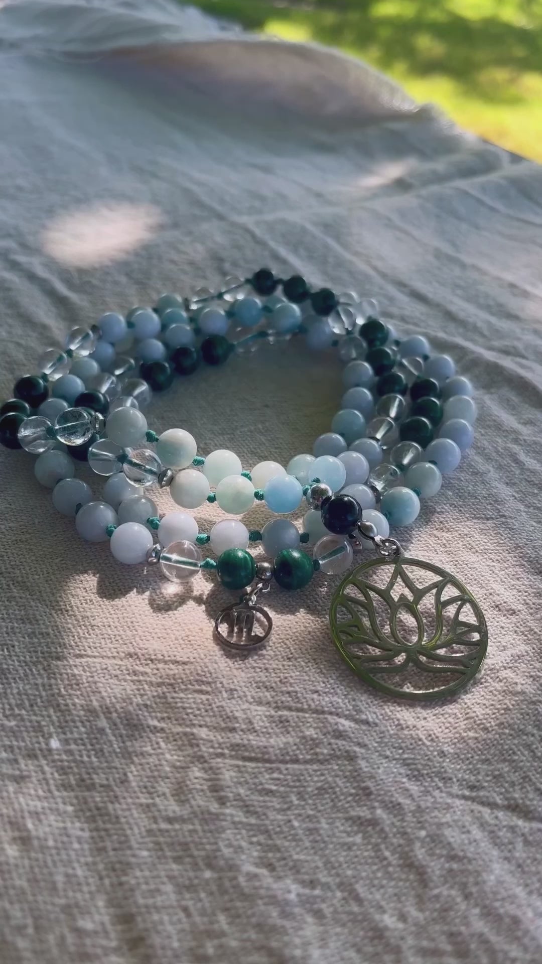 Video frame of Mala for Scorpio in meditative setting with incense